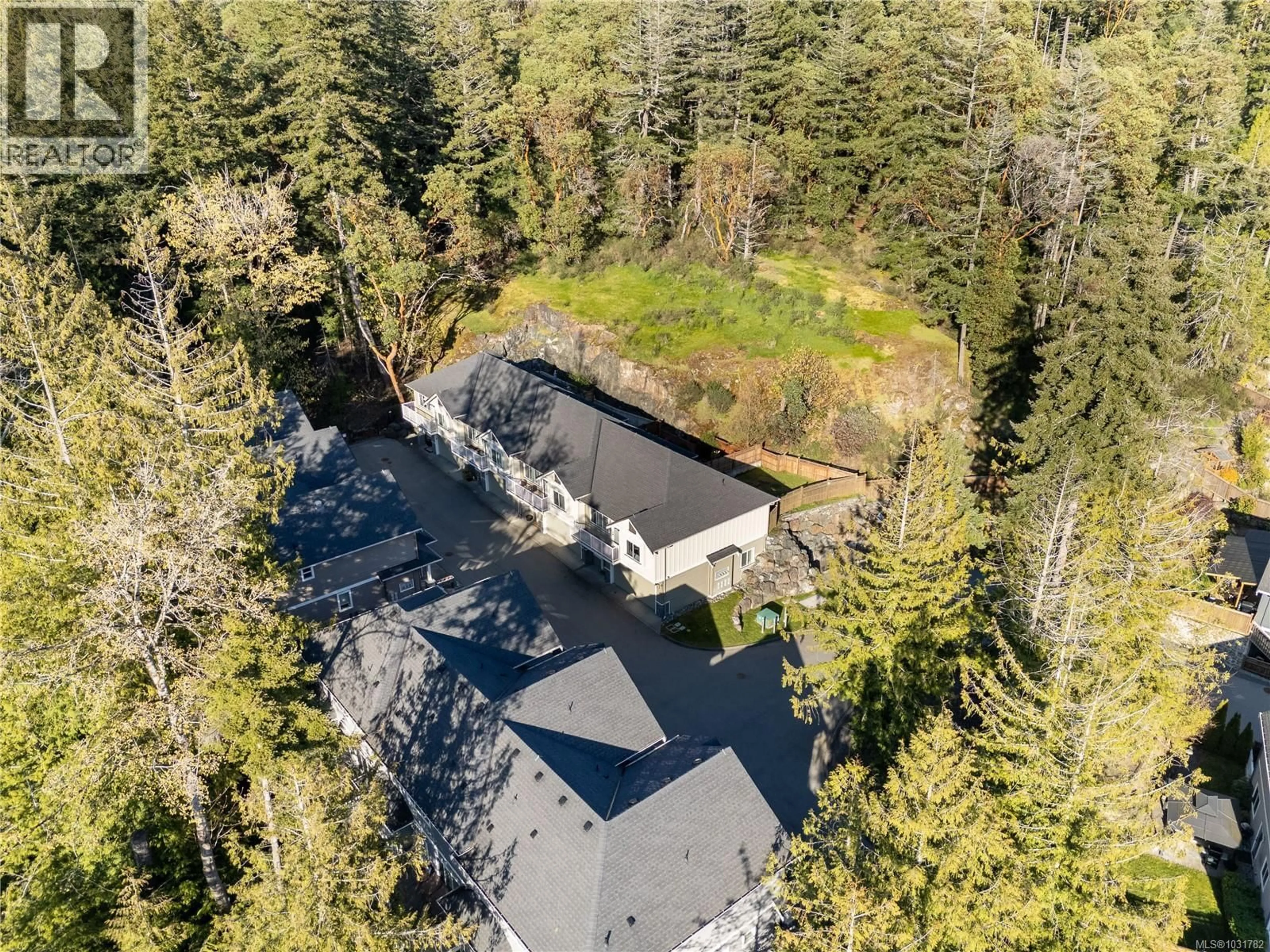 A pic from outside/outdoor area/front of a property/back of a property/a pic from drone, forest/trees view for 104 - 3439 AMBROSIA CRESCENT, Langford British Columbia V9C0K4