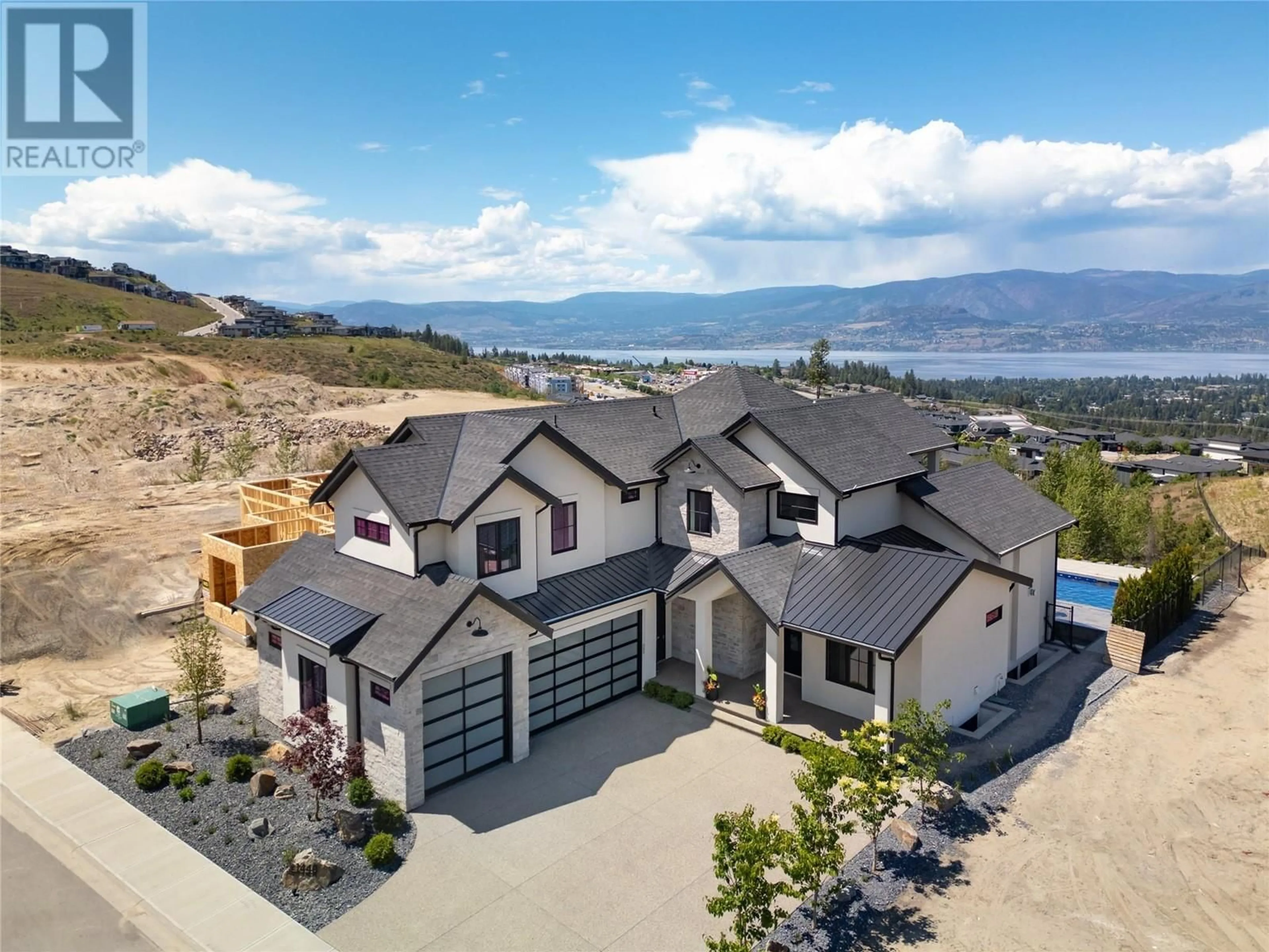 Frontside or backside of a home, mountain for 1440 Hill Spring Place, Kelowna British Columbia V1W0E5