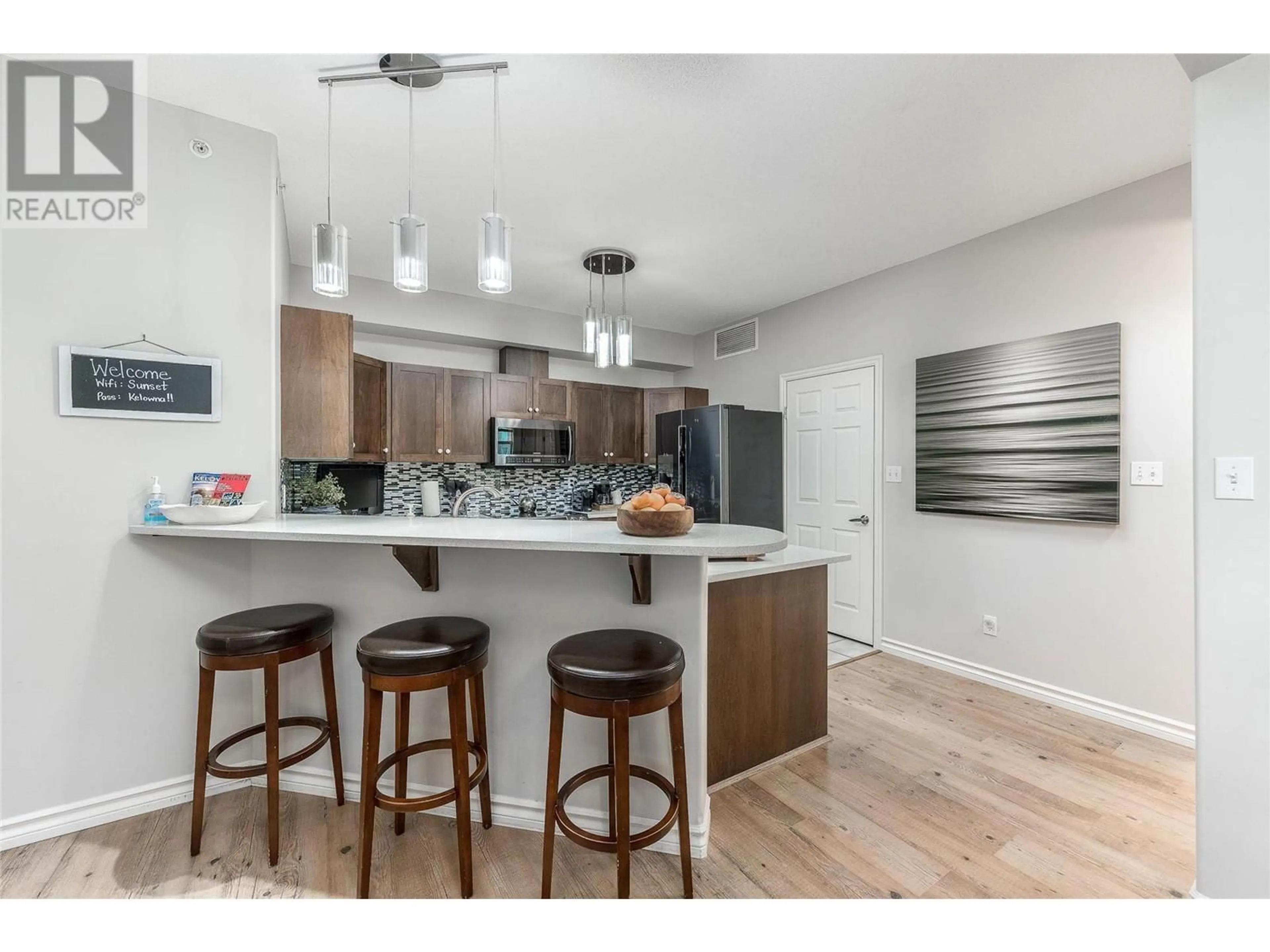 Open concept kitchen, wood/laminate floor for 1202 - 1128 SUNSET DRIVE, Kelowna British Columbia V1Y9W7