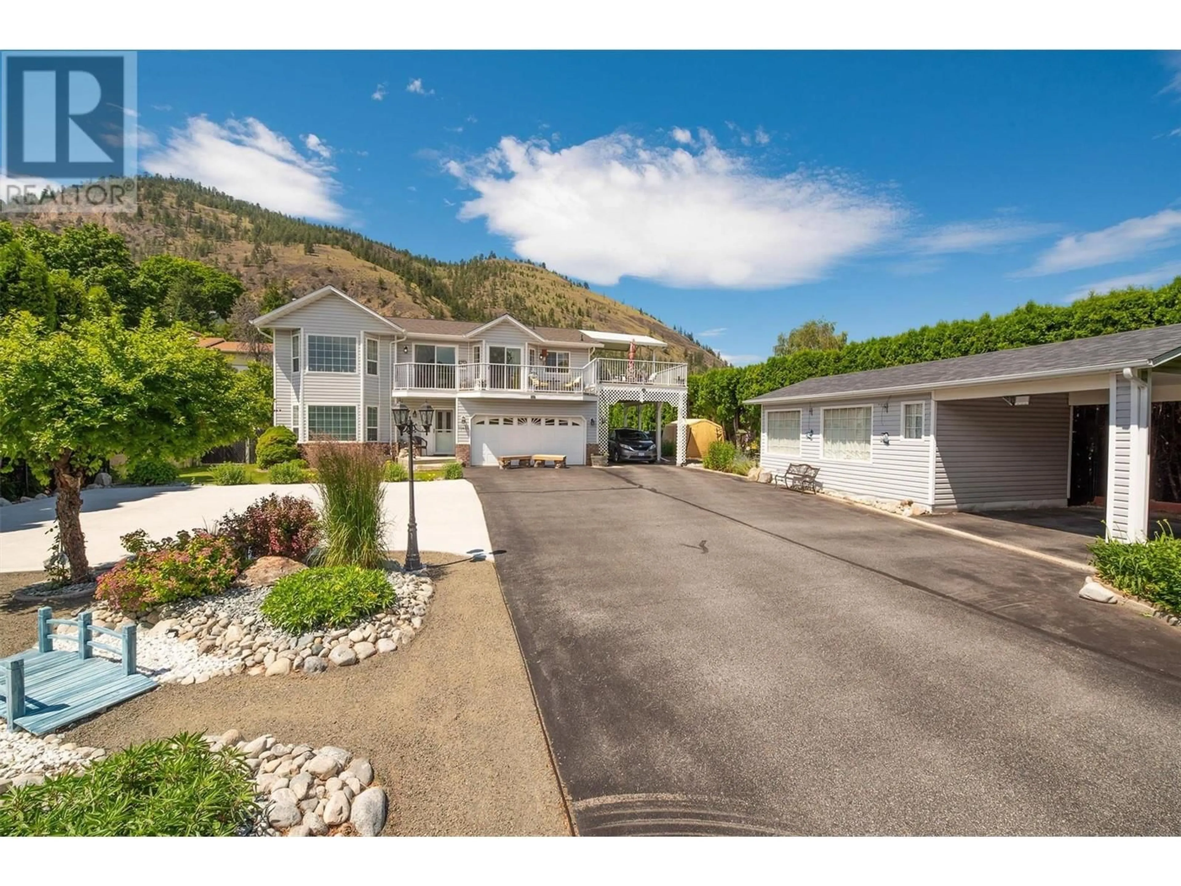 Frontside or backside of a home for 10420 Happy Valley Road, Summerland British Columbia V0H1Z7