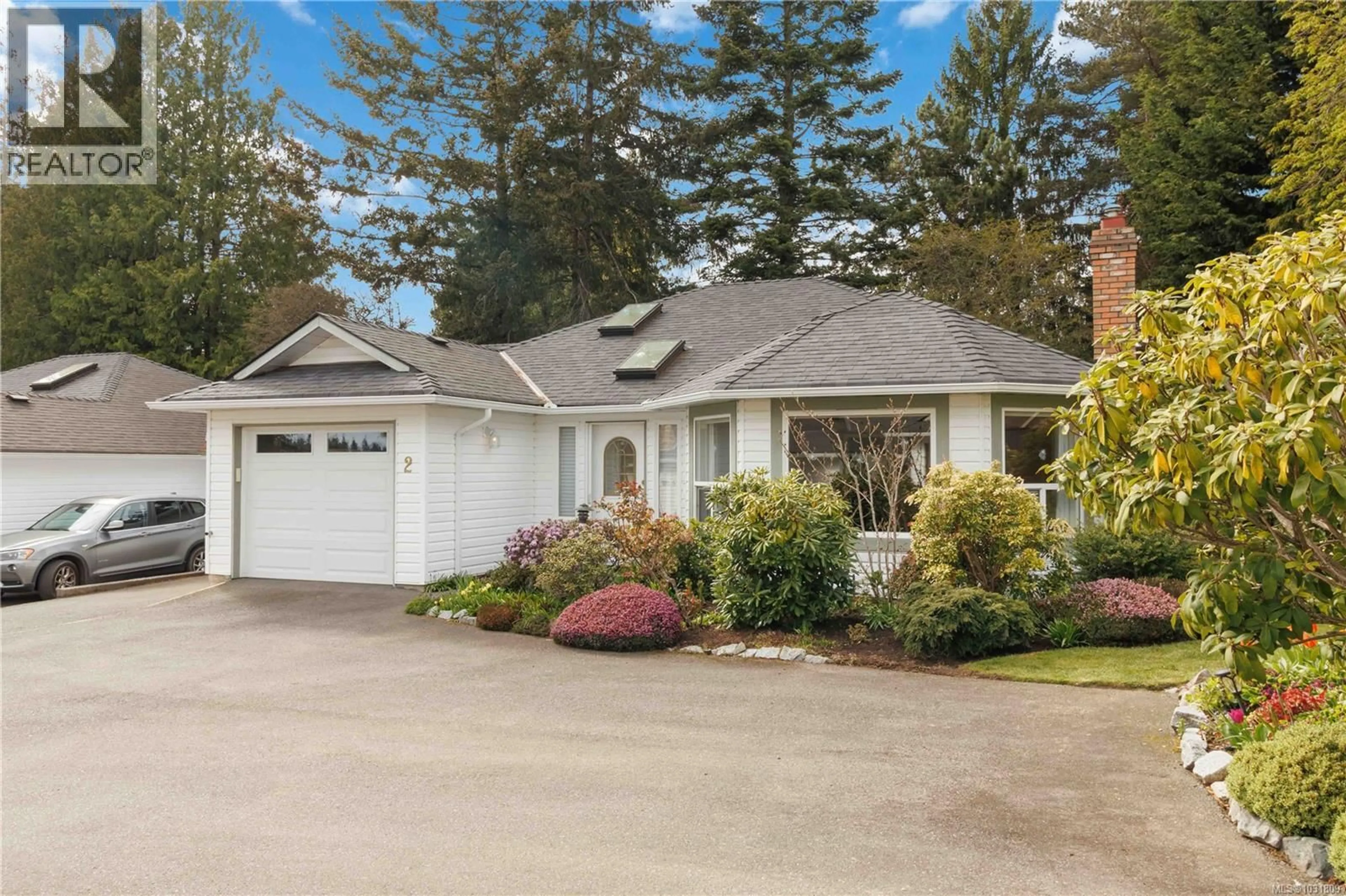 Home with vinyl exterior material, street for 2 - 1968 CULTRA AVENUE, Central Saanich British Columbia V8M2J8