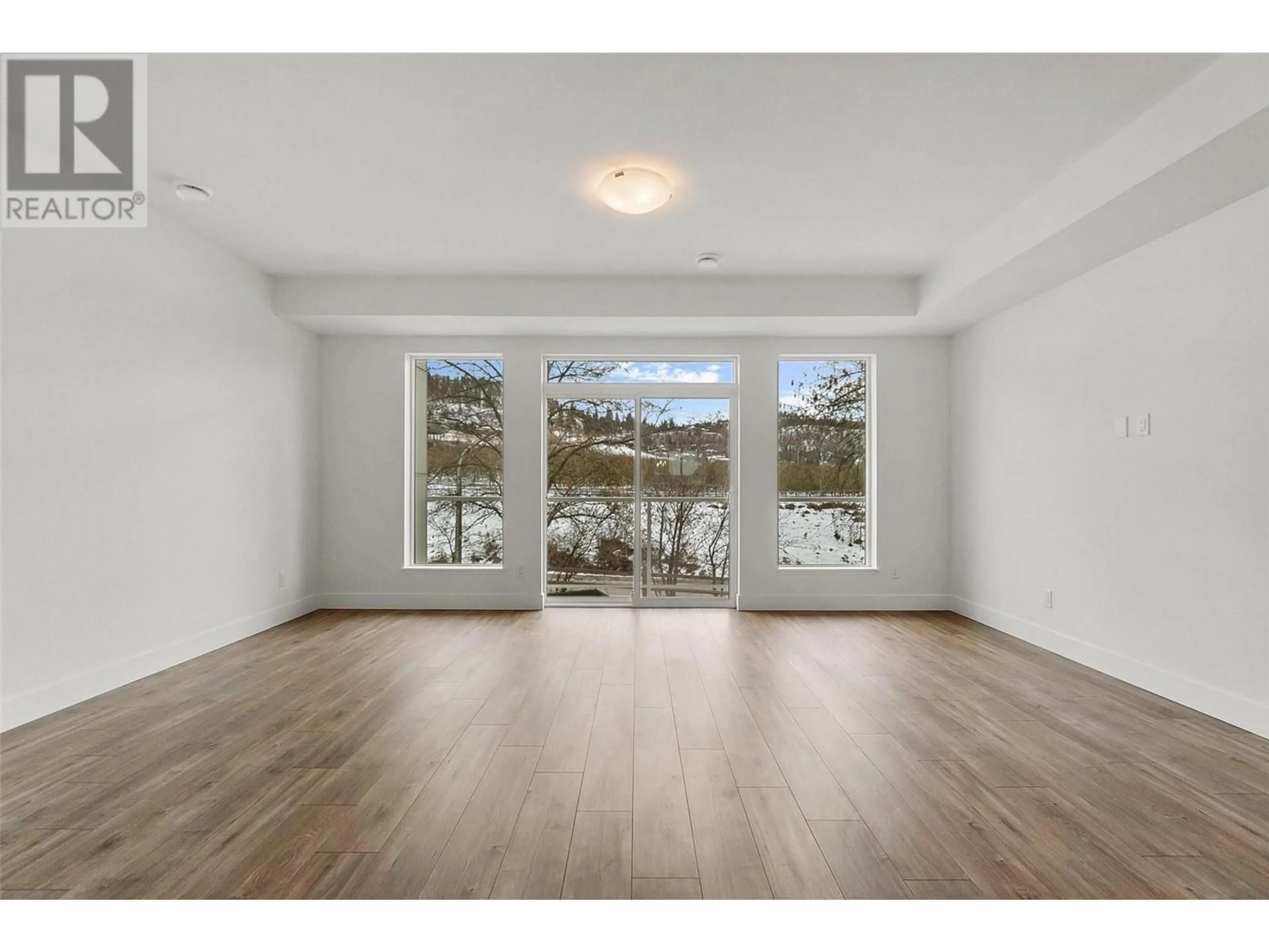 A pic of a room, wood floors for 720 Valley Road Unit# 49, Kelowna British Columbia V1V2E6