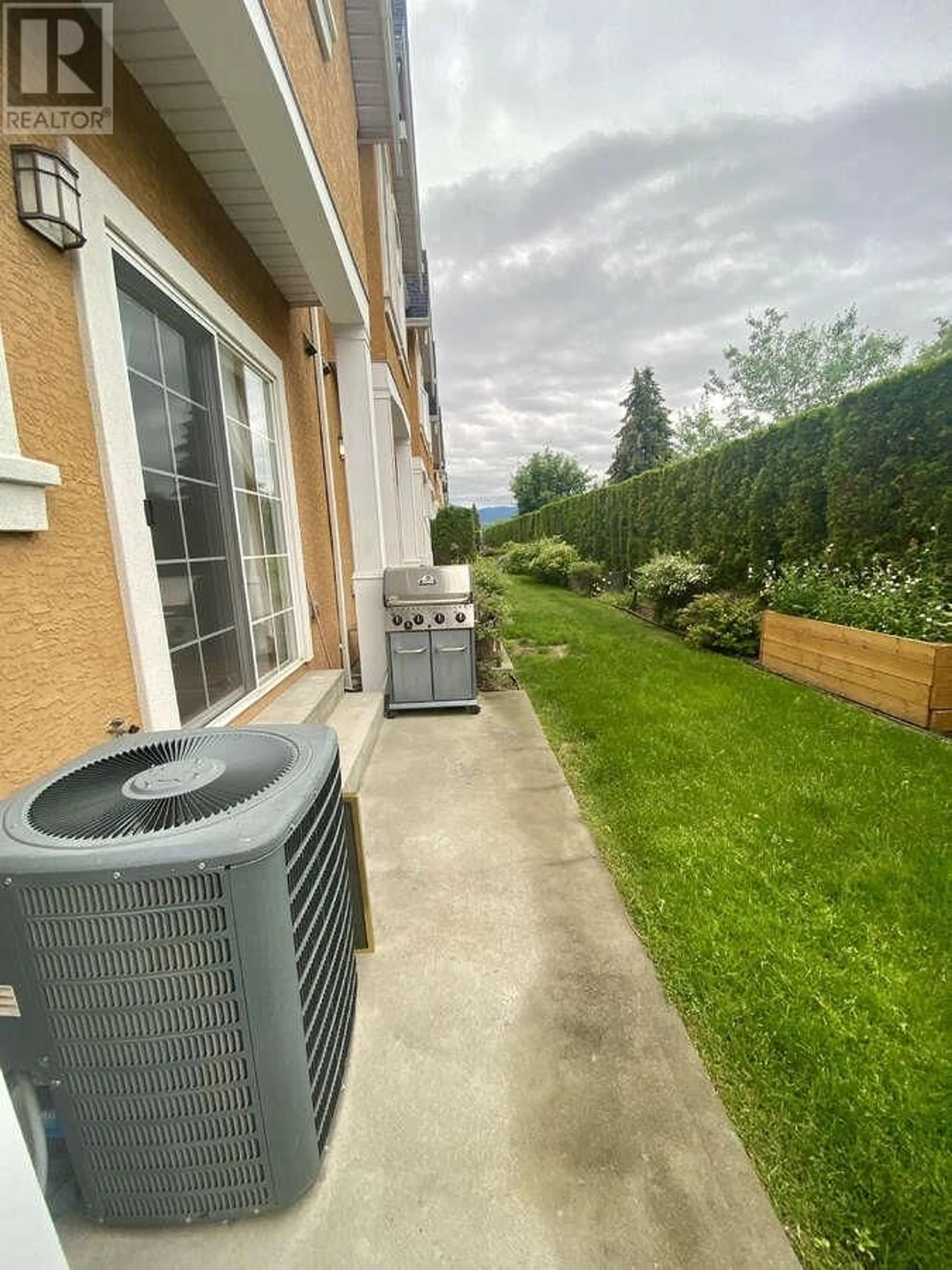 Patio, the fenced backyard for 456 McPhee Street Unit# 122, Kelowna British Columbia V1X8C5