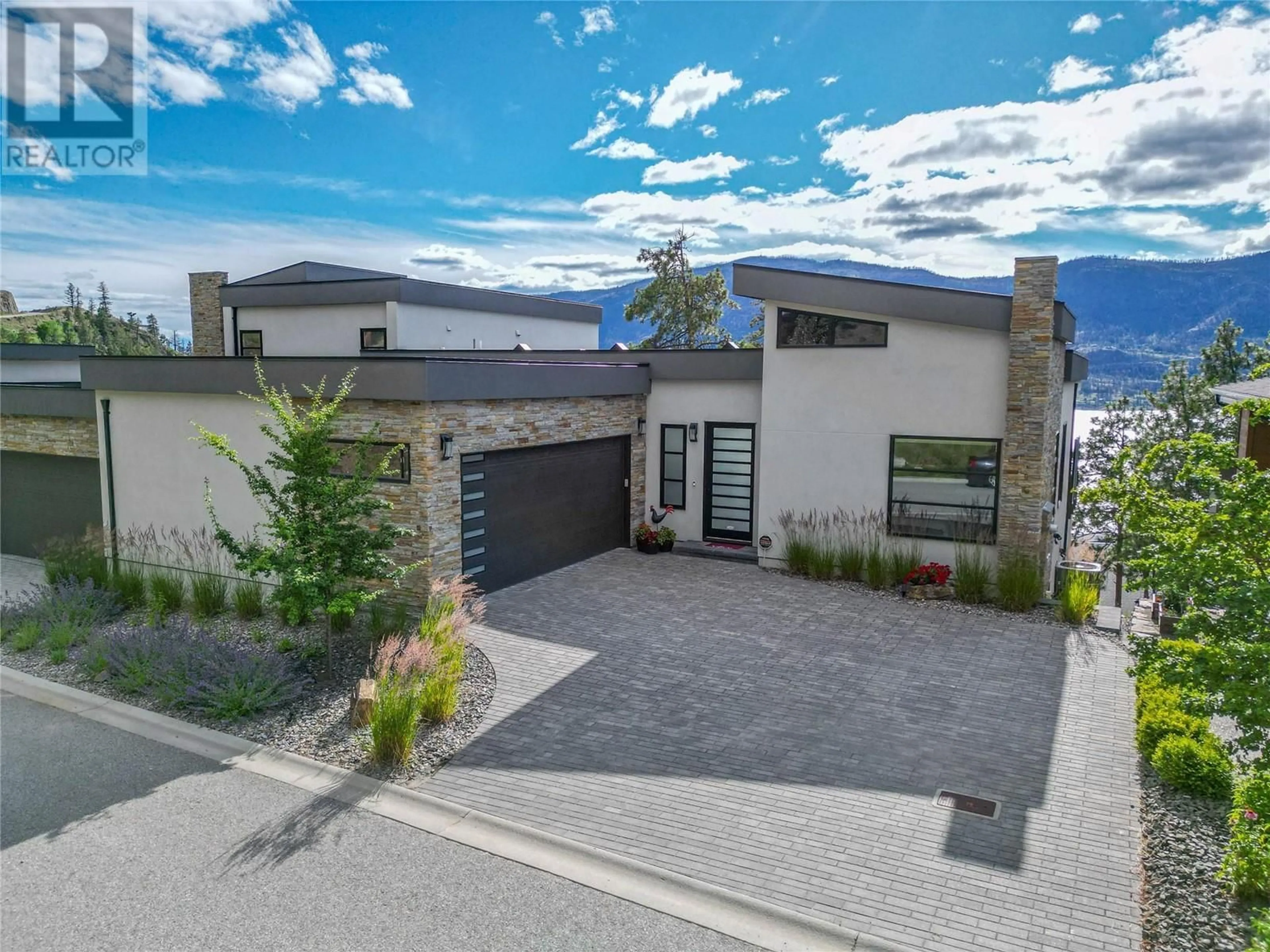 Frontside or backside of a home, the street view for 3434 Blue Grass Lane, Kelowna British Columbia V1V3G1