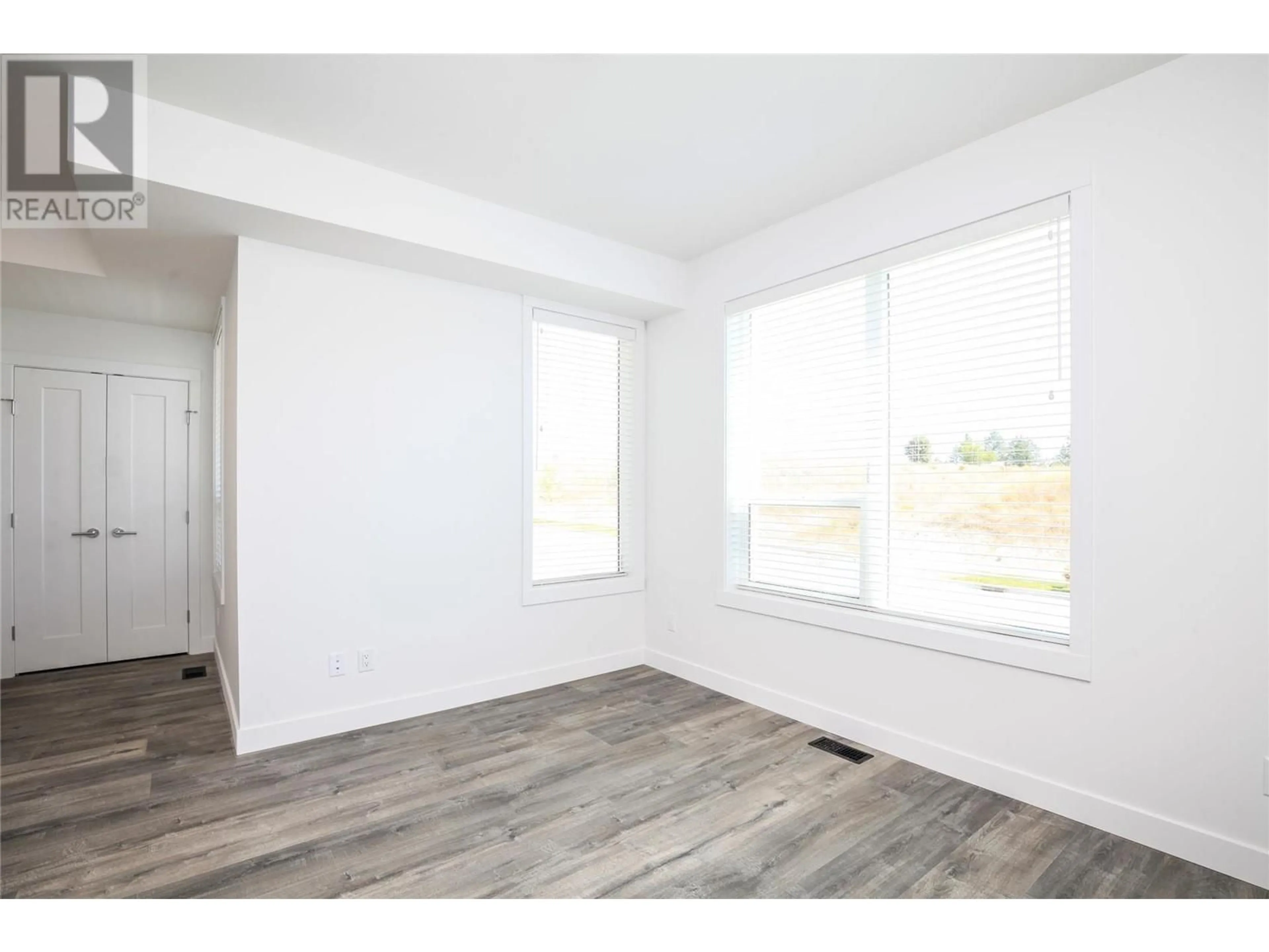 A pic of a room, wood floors for 610 Academy Way Unit# 118, Kelowna British Columbia V1V0E8