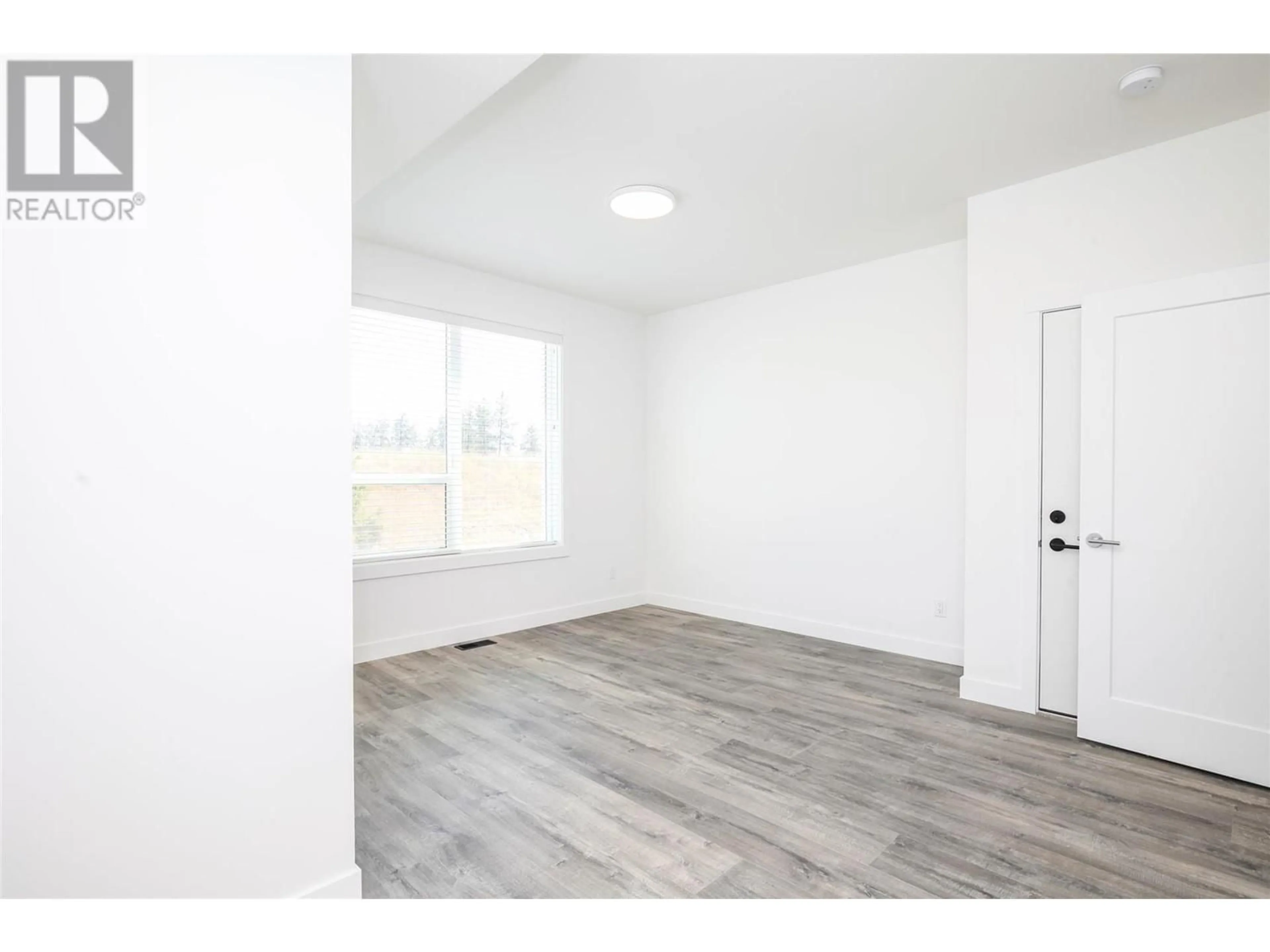 A pic of a room, wood floors for 610 Academy Way Unit# 118, Kelowna British Columbia V1V0E8