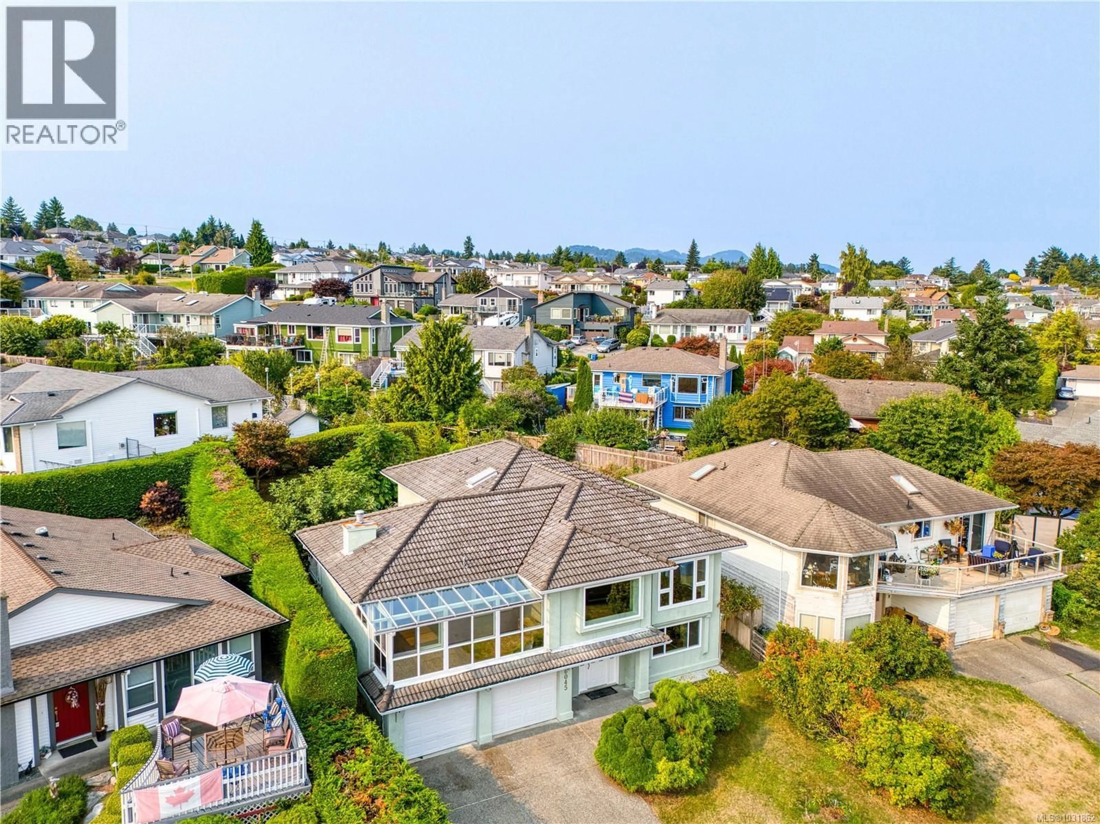 A pic from outside/outdoor area/front of a property/back of a property/a pic from drone, street for 6045 ICARUS DRIVE, Nanaimo British Columbia V9V1B7