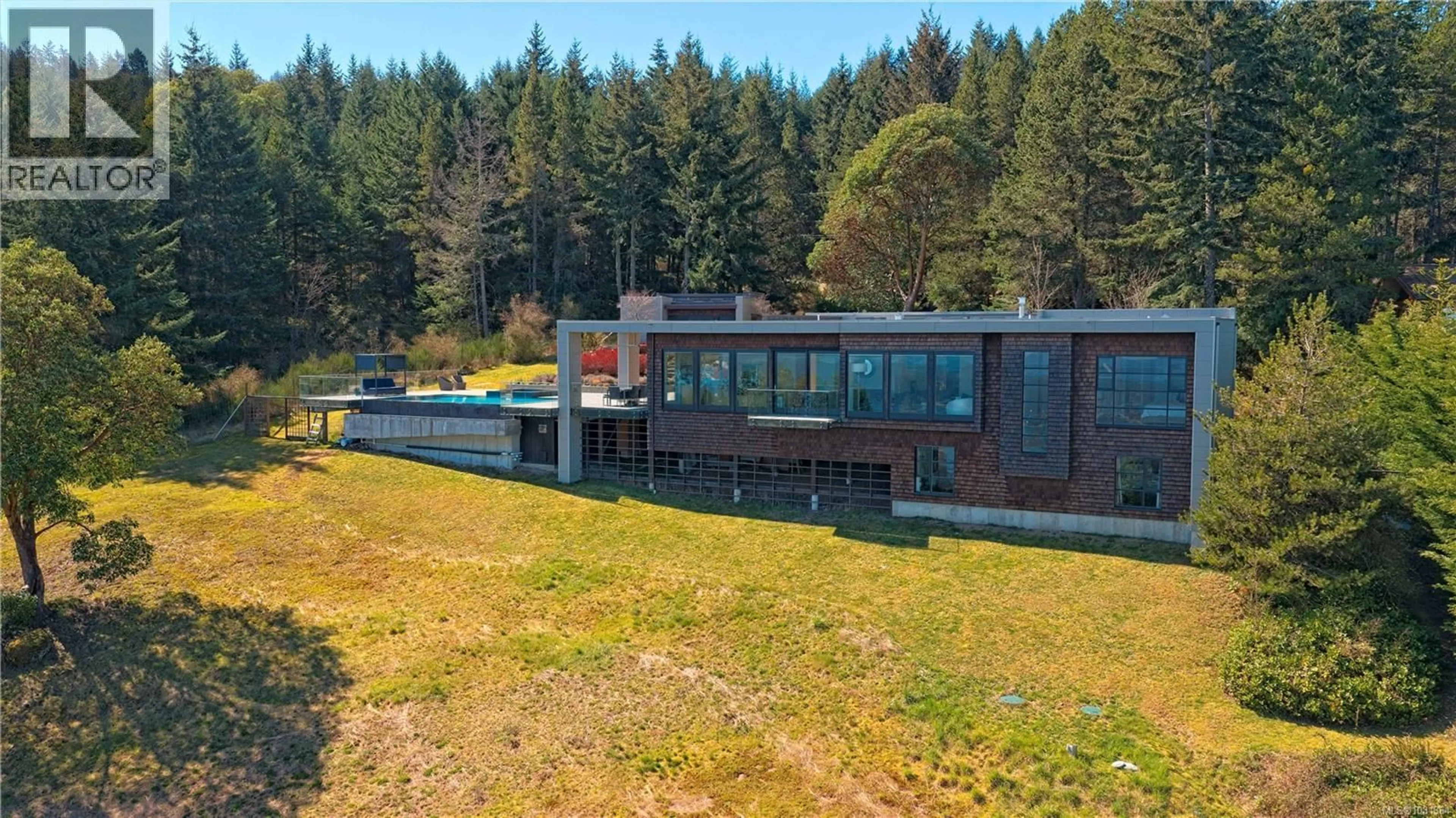 A pic from outside/outdoor area/front of a property/back of a property/a pic from drone, building for 136 WILKIE WAY, Salt Spring British Columbia V8K1E6