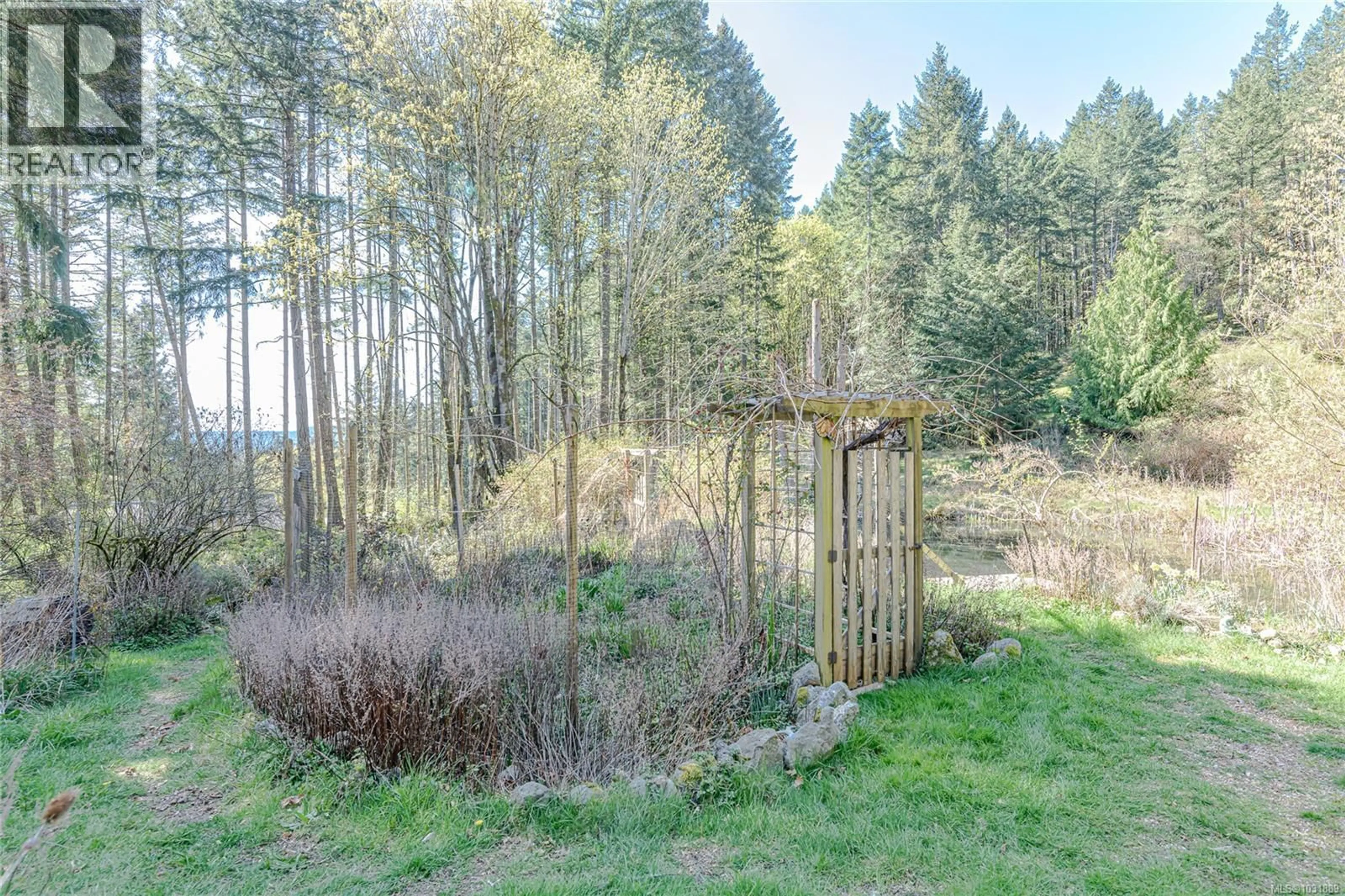 A pic from outside/outdoor area/front of a property/back of a property/a pic from drone, forest/trees view for 140 SALTAIR LANE, Salt Spring British Columbia V8K1Y5