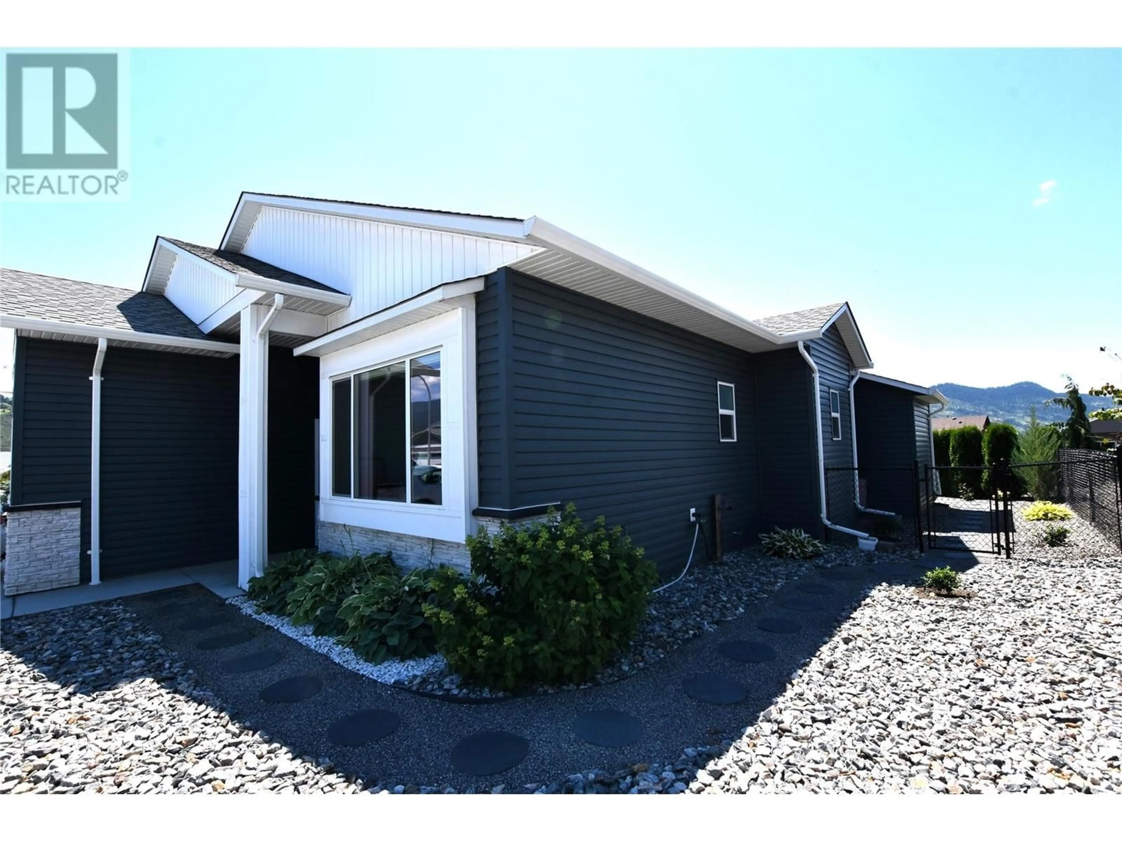 Frontside or backside of a home for 909 9 Avenue, Vernon British Columbia V1H1Z1