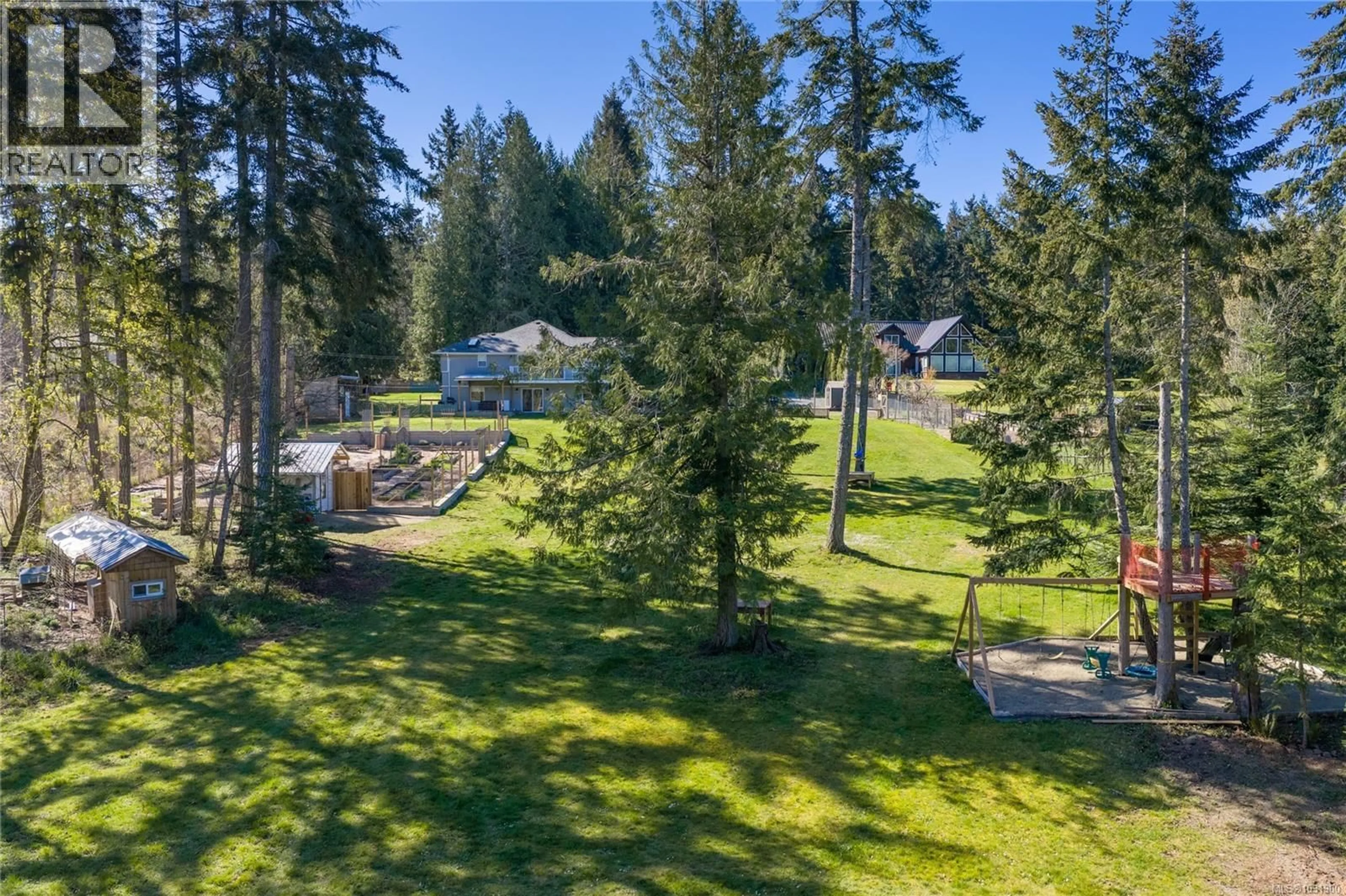 A pic from outside/outdoor area/front of a property/back of a property/a pic from drone, forest/trees view for 511 FOURNEAU WAY, Parksville British Columbia V9P2J7