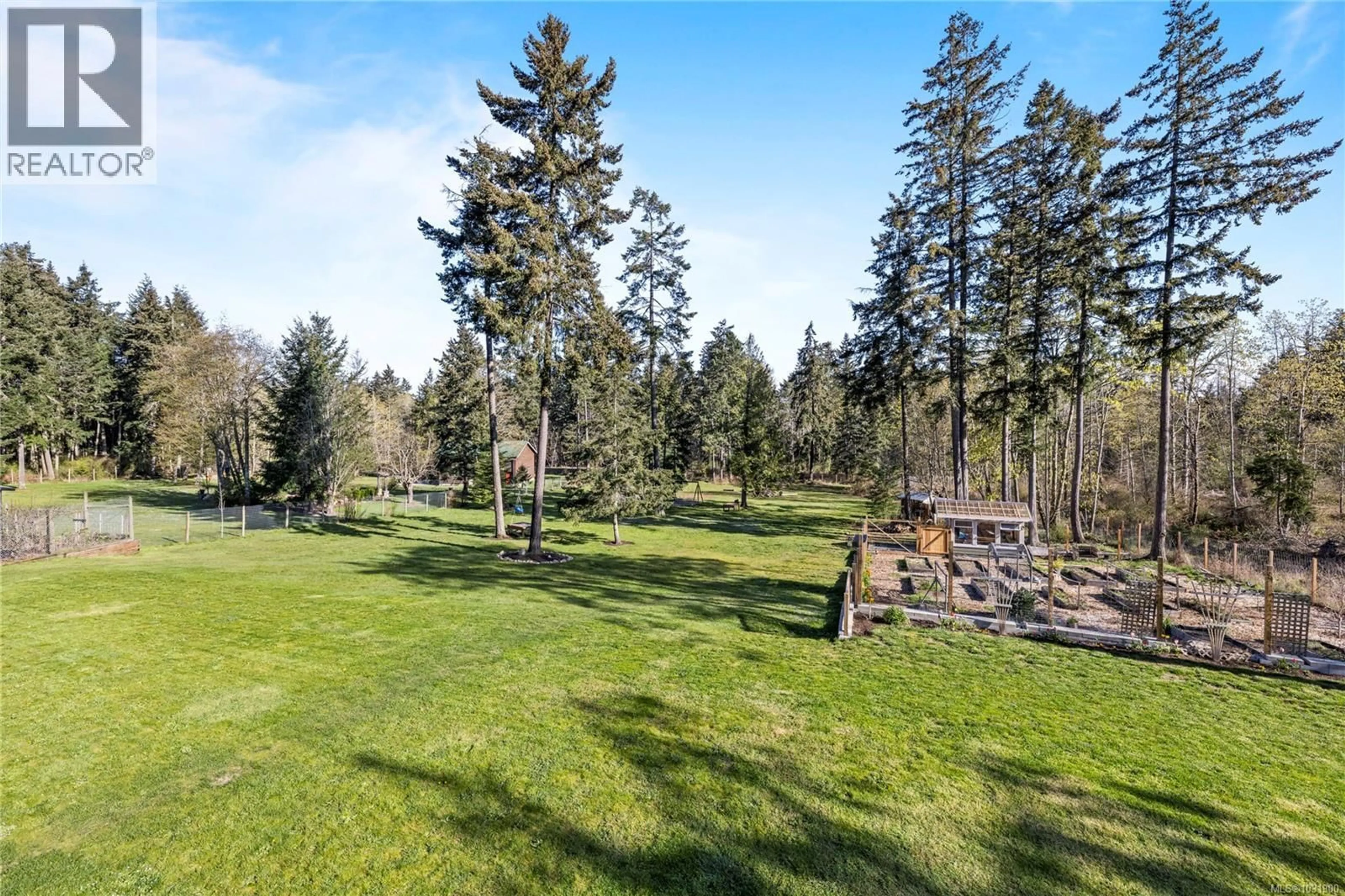 A pic from outside/outdoor area/front of a property/back of a property/a pic from drone, forest/trees view for 511 FOURNEAU WAY, Parksville British Columbia V9P2J7