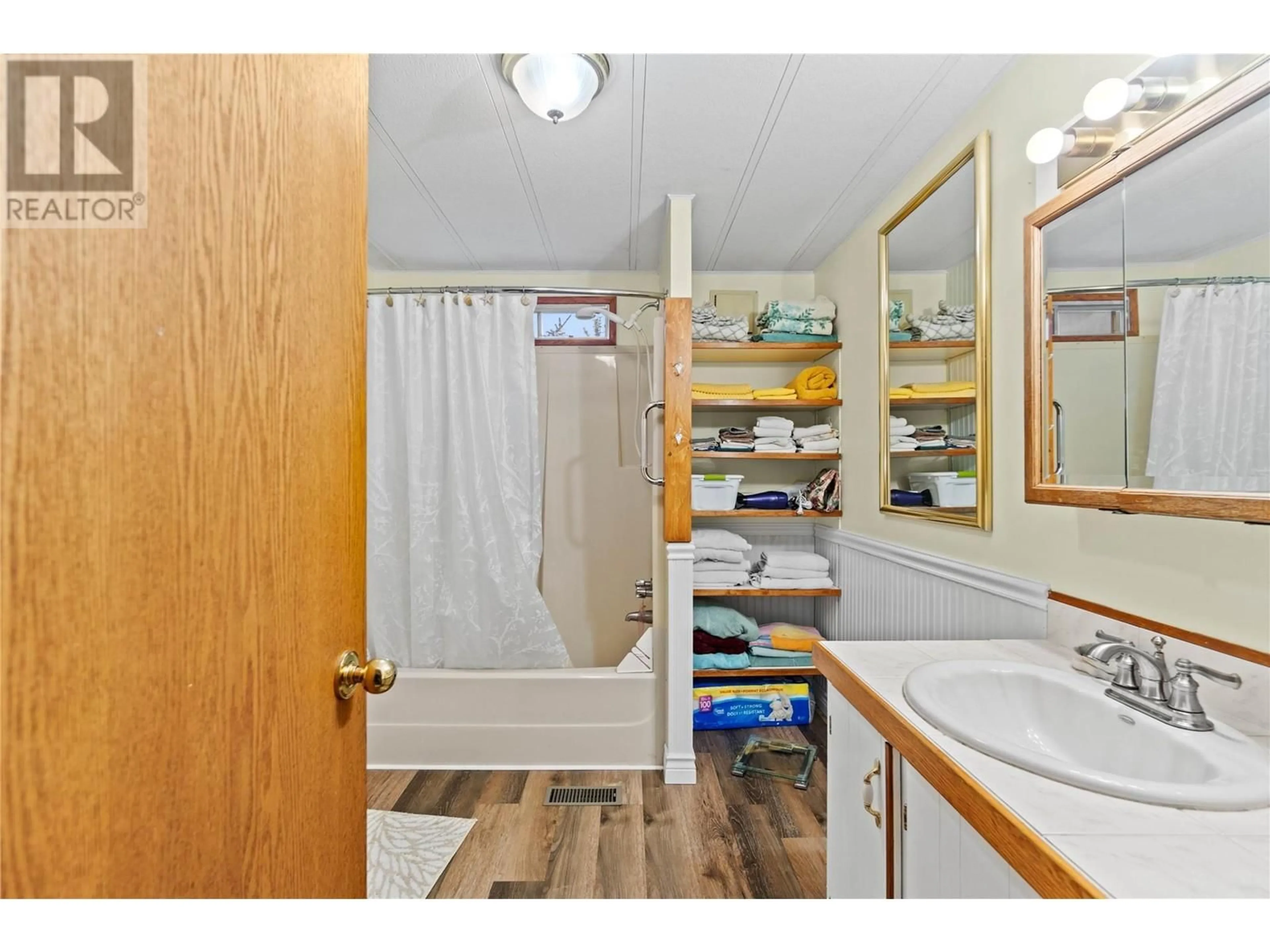 Standard bathroom, wood floors for 1452 Blind Bay Road, Sorrento British Columbia V0E2W0