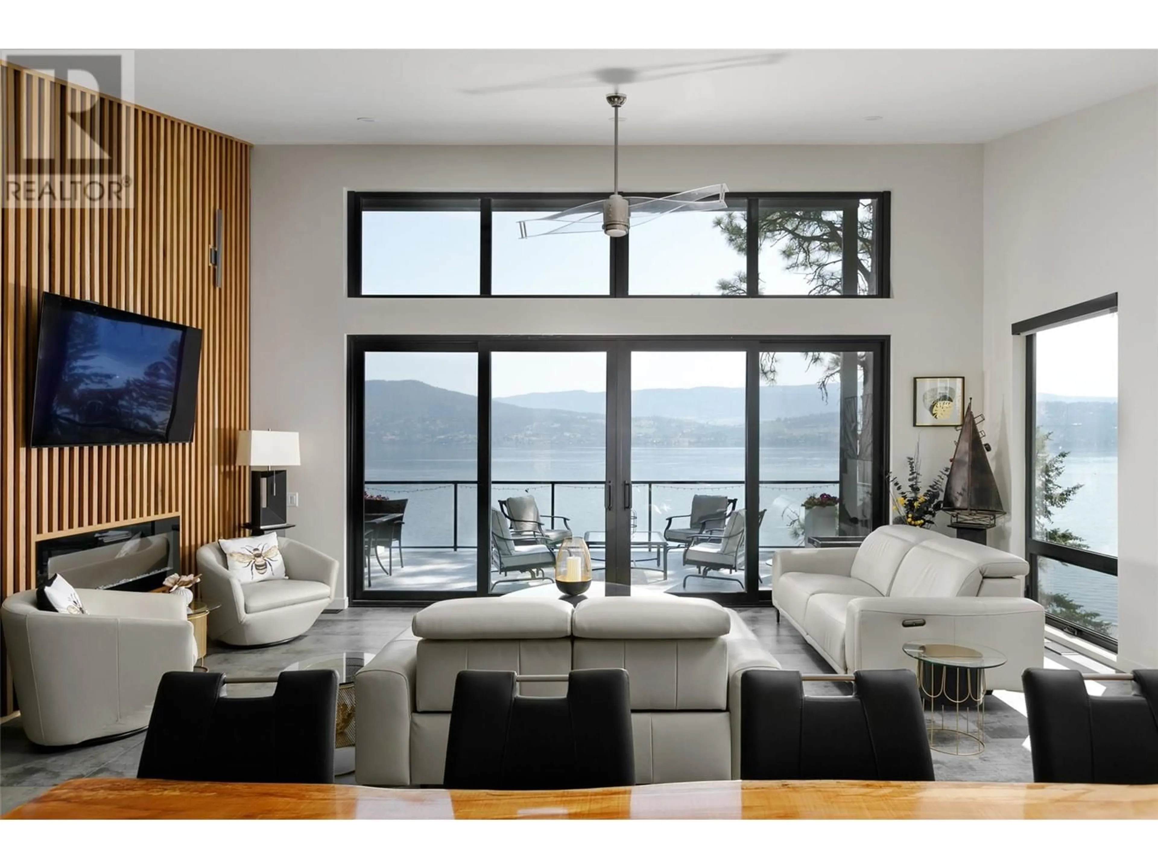 Living room with furniture, wood/laminate floor for 32 - 4401 WESTSIDE ROAD NORTH, Kelowna British Columbia V1Z3P8