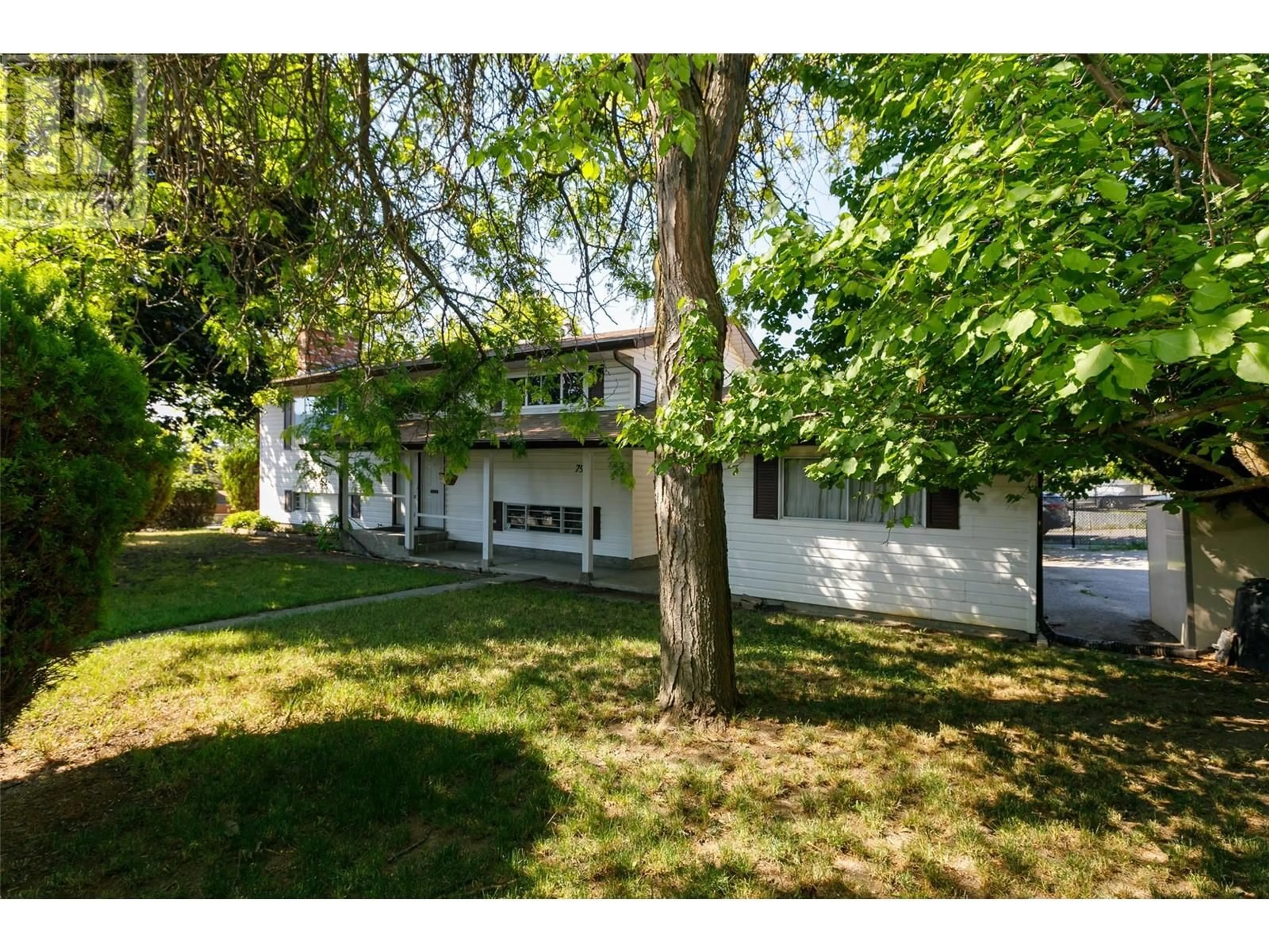 Frontside or backside of a home, the fenced backyard for 790 Caldow Street, Kelowna British Columbia V1V1A8