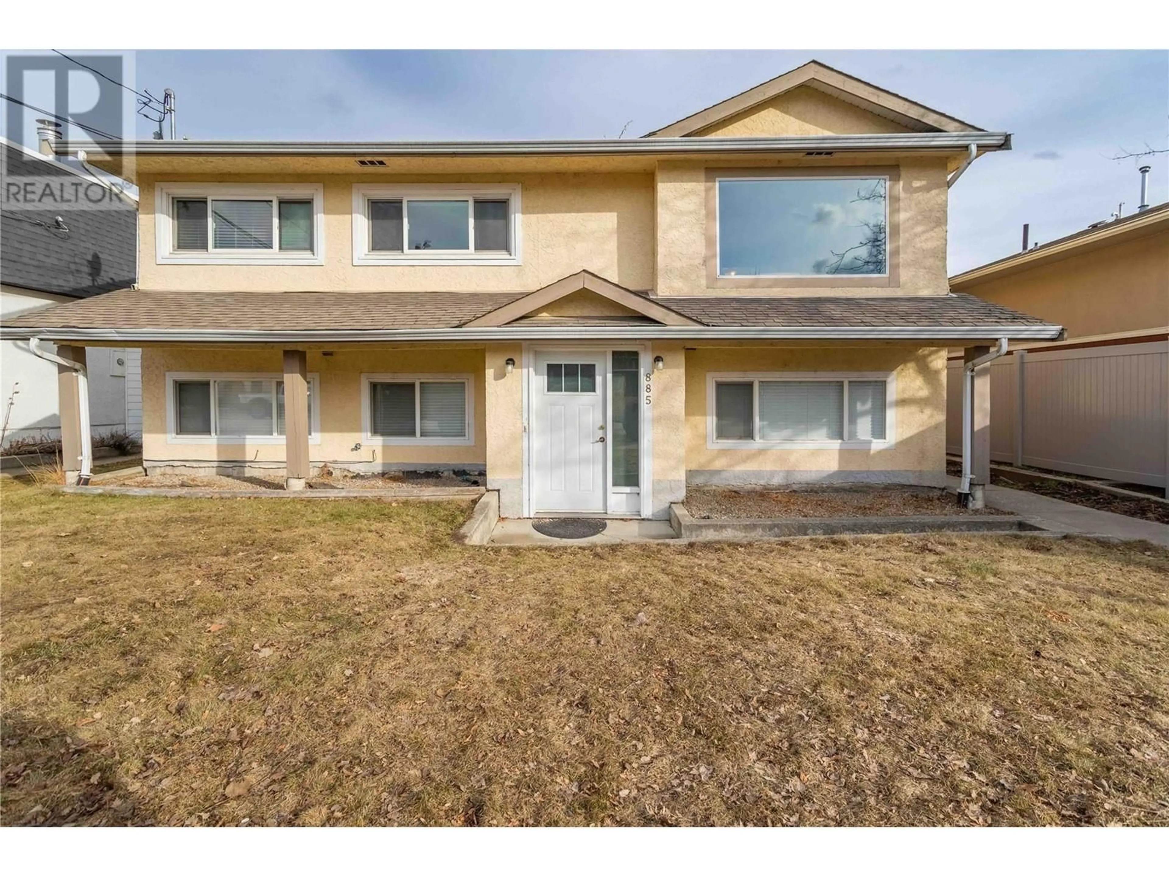 Home with vinyl exterior material, street for 885 WALROD STREET, Kelowna British Columbia V1Y2S4