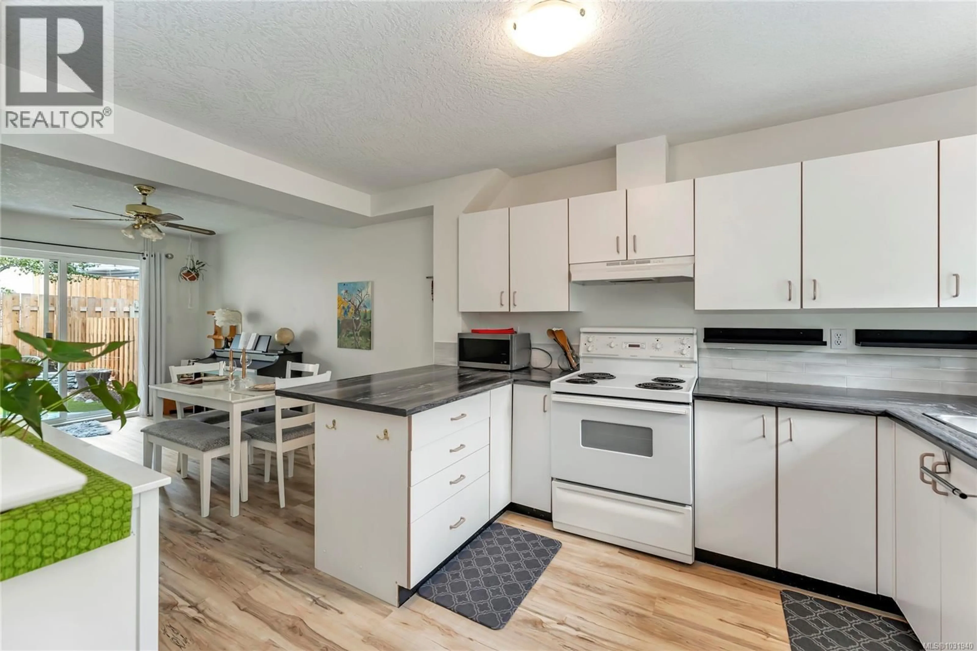Open concept kitchen, wood/laminate floor for 7 - 3242 COWICHAN LAKE ROAD, Duncan British Columbia V9L4B9