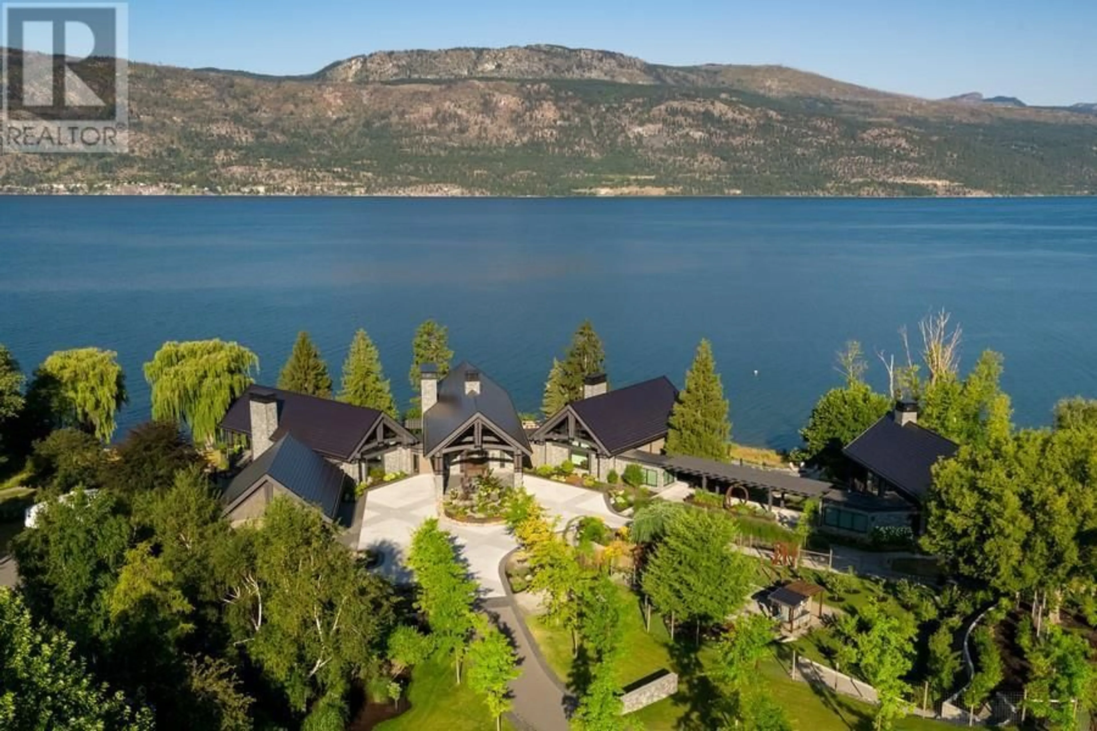 A pic from outside/outdoor area/front of a property/back of a property/a pic from drone, water/lake/river/ocean view for 12391 PIXTON ROAD, Lake Country British Columbia V4V1A1