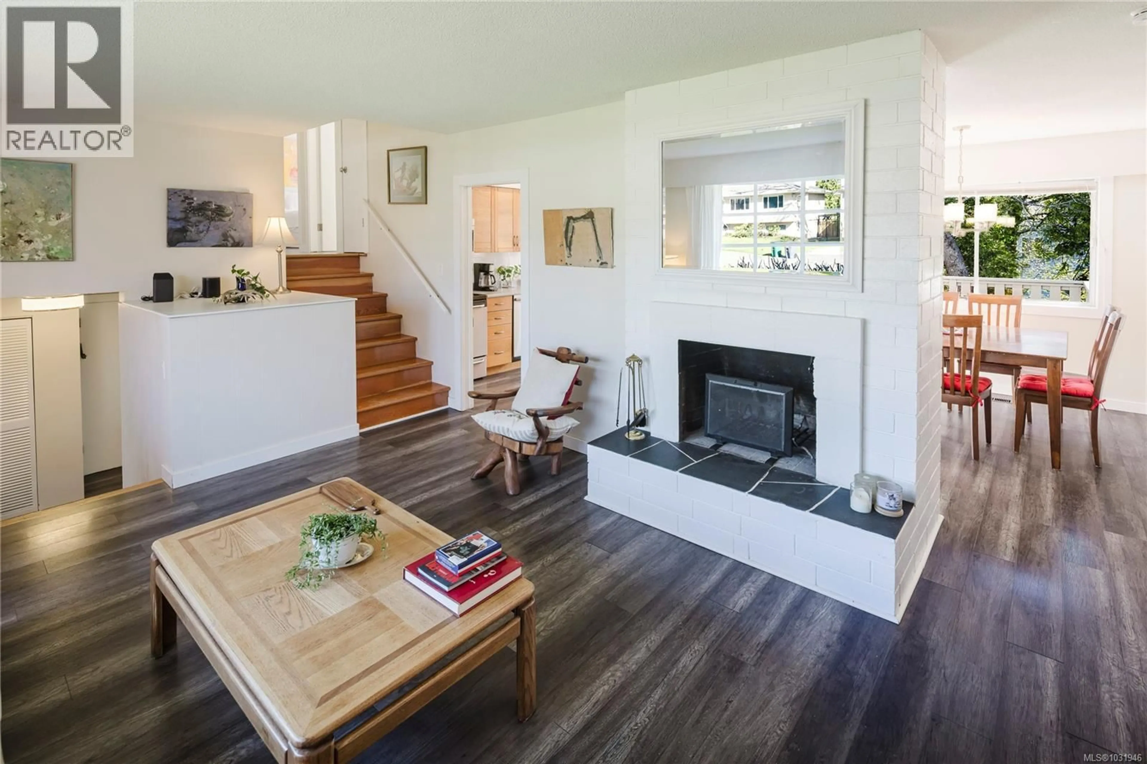 Living room with furniture, wood/laminate floor for 3949 MARGOT PLACE, Saanich British Columbia V8P3M2