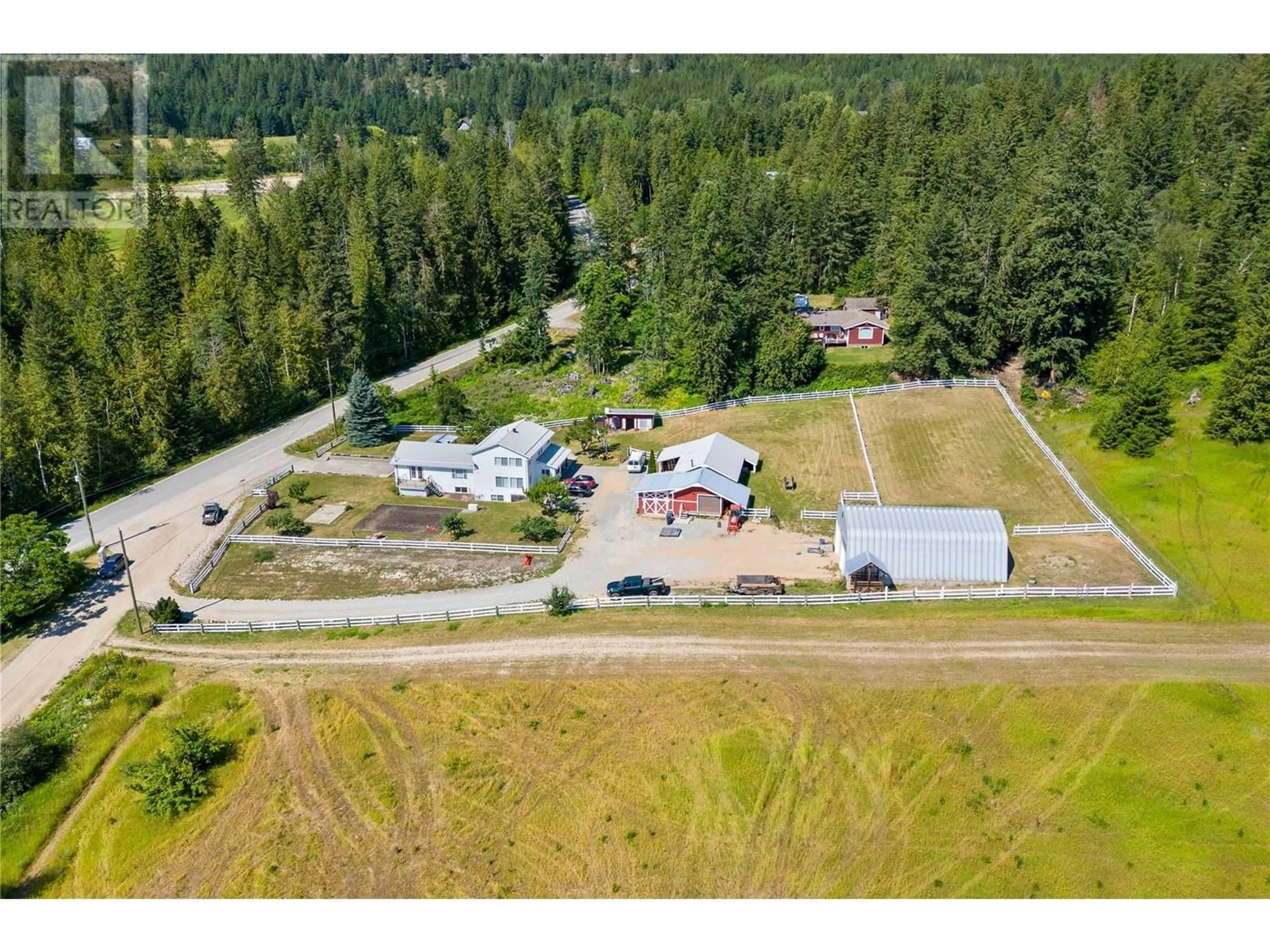 Frontside or backside of a home, the fenced backyard for 5611 5 Avenue SW, Salmon Arm British Columbia V1E3B4