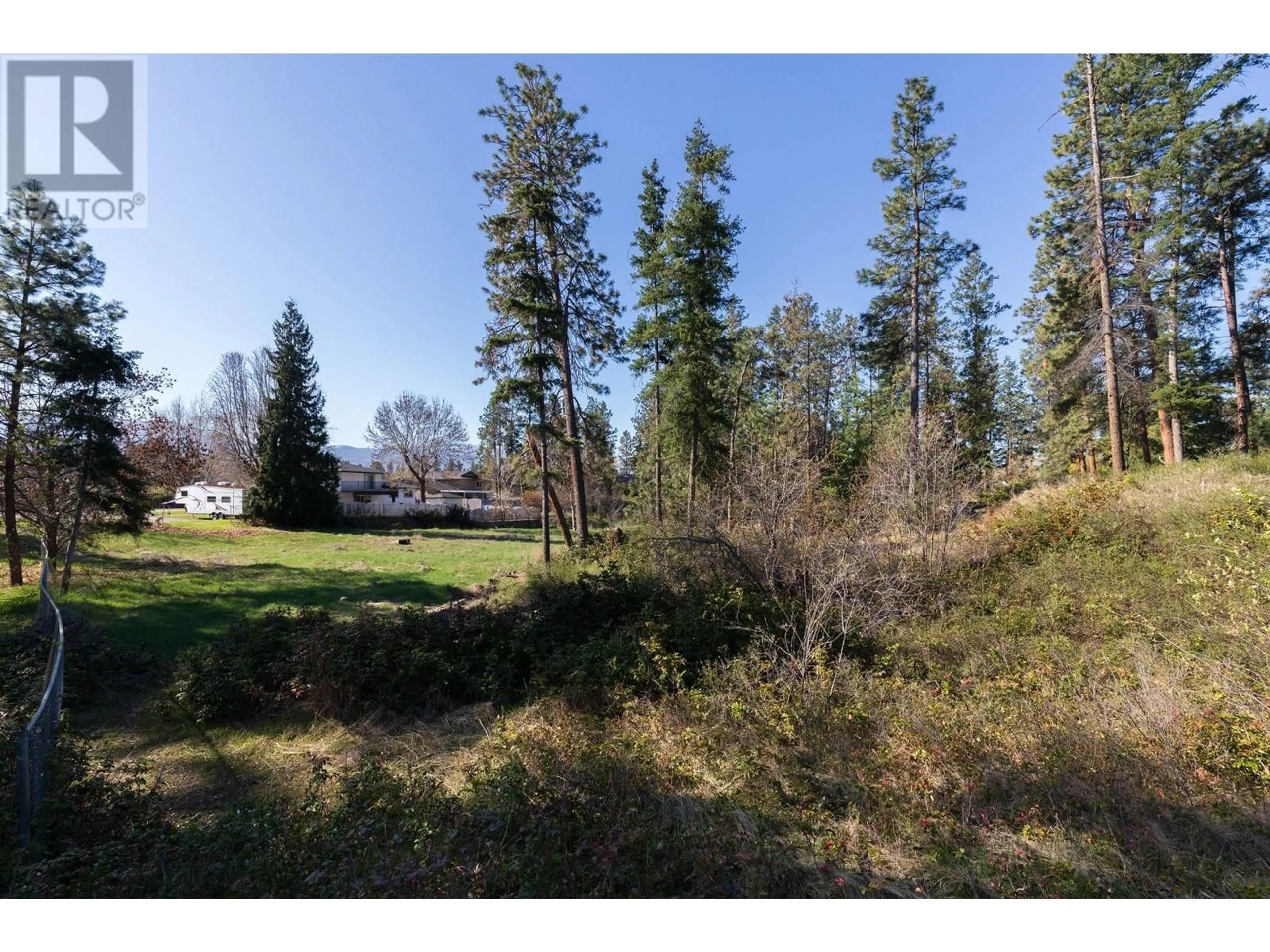 A pic from outside/outdoor area/front of a property/back of a property/a pic from drone, forest/trees view for 3297 HALL ROAD, Kelowna British Columbia V1W2V1