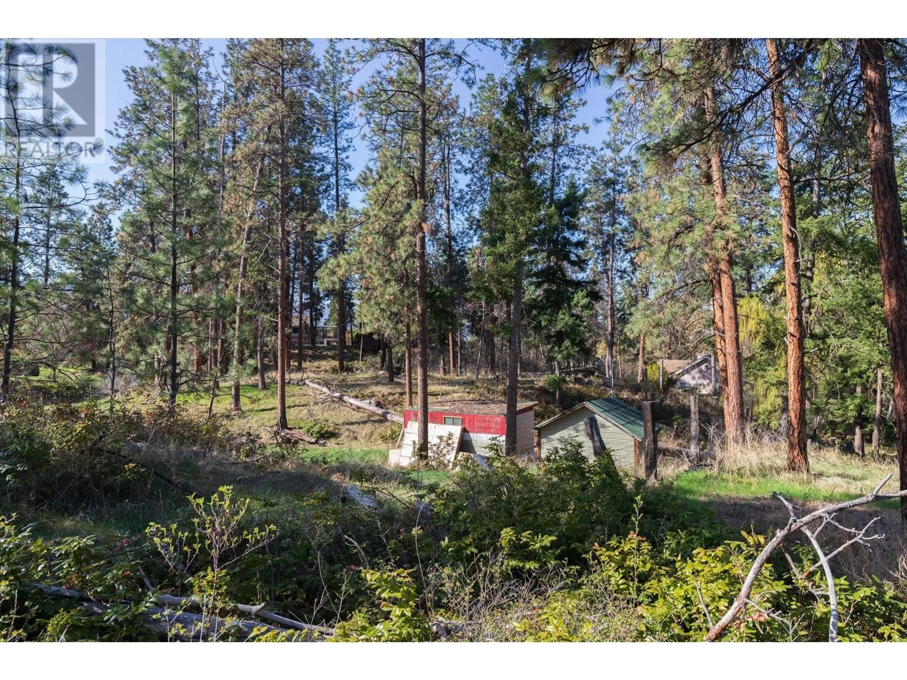 A pic from outside/outdoor area/front of a property/back of a property/a pic from drone, forest/trees view for 3297 HALL ROAD, Kelowna British Columbia V1W2V1