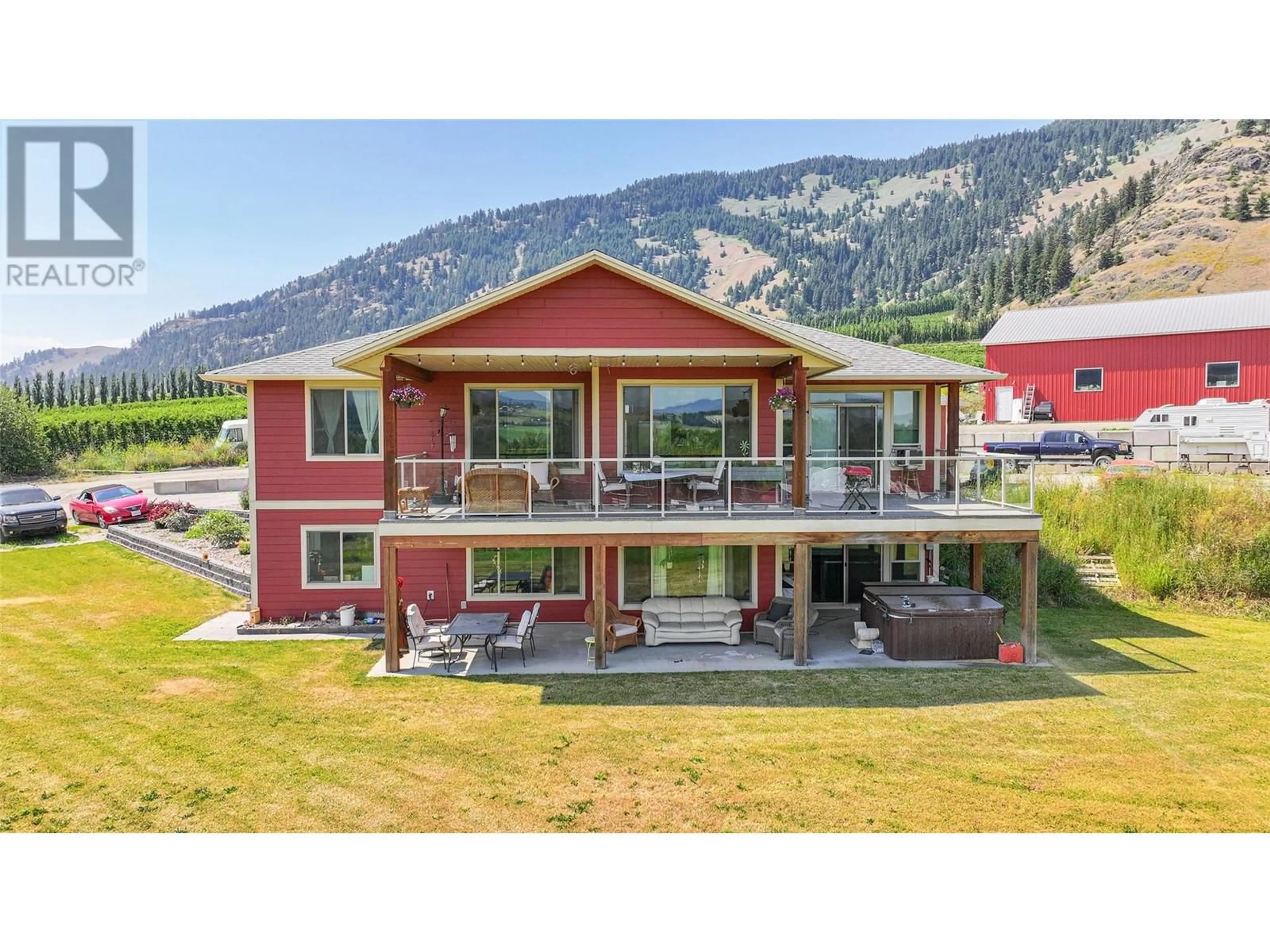 A pic from outside/outdoor area/front of a property/back of a property/a pic from drone, mountain view for 6205 6 HIGHWAY, Coldstream British Columbia V1B3C7
