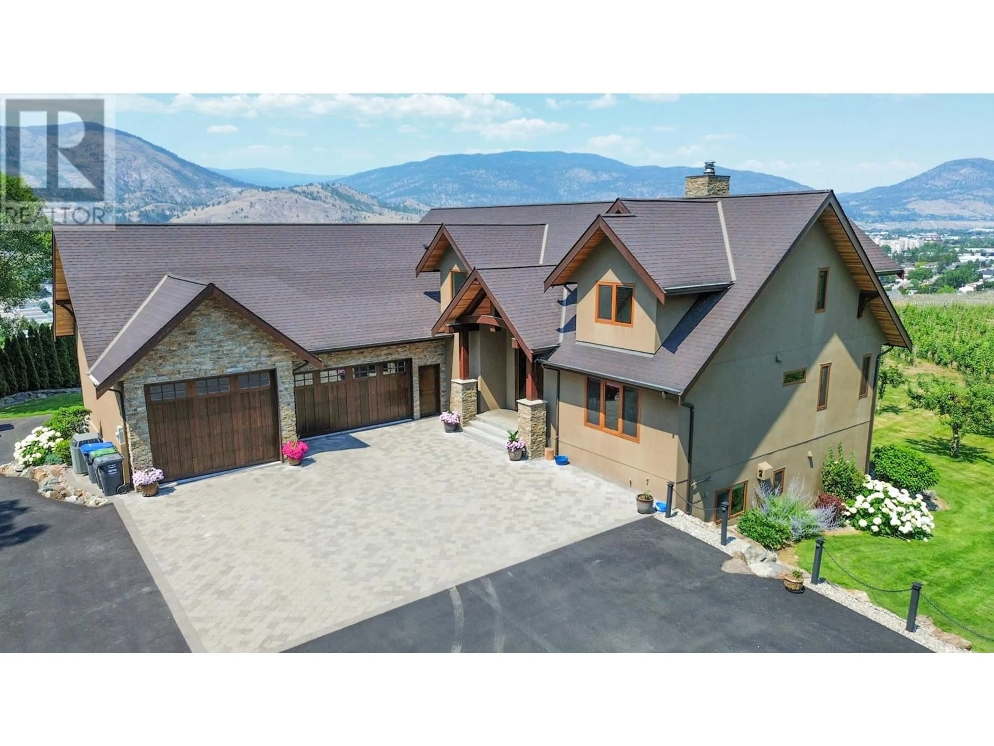 A pic from outside/outdoor area/front of a property/back of a property/a pic from drone, mountain view for 3175 VALLEYVIEW ROAD, Penticton British Columbia V2A8W8