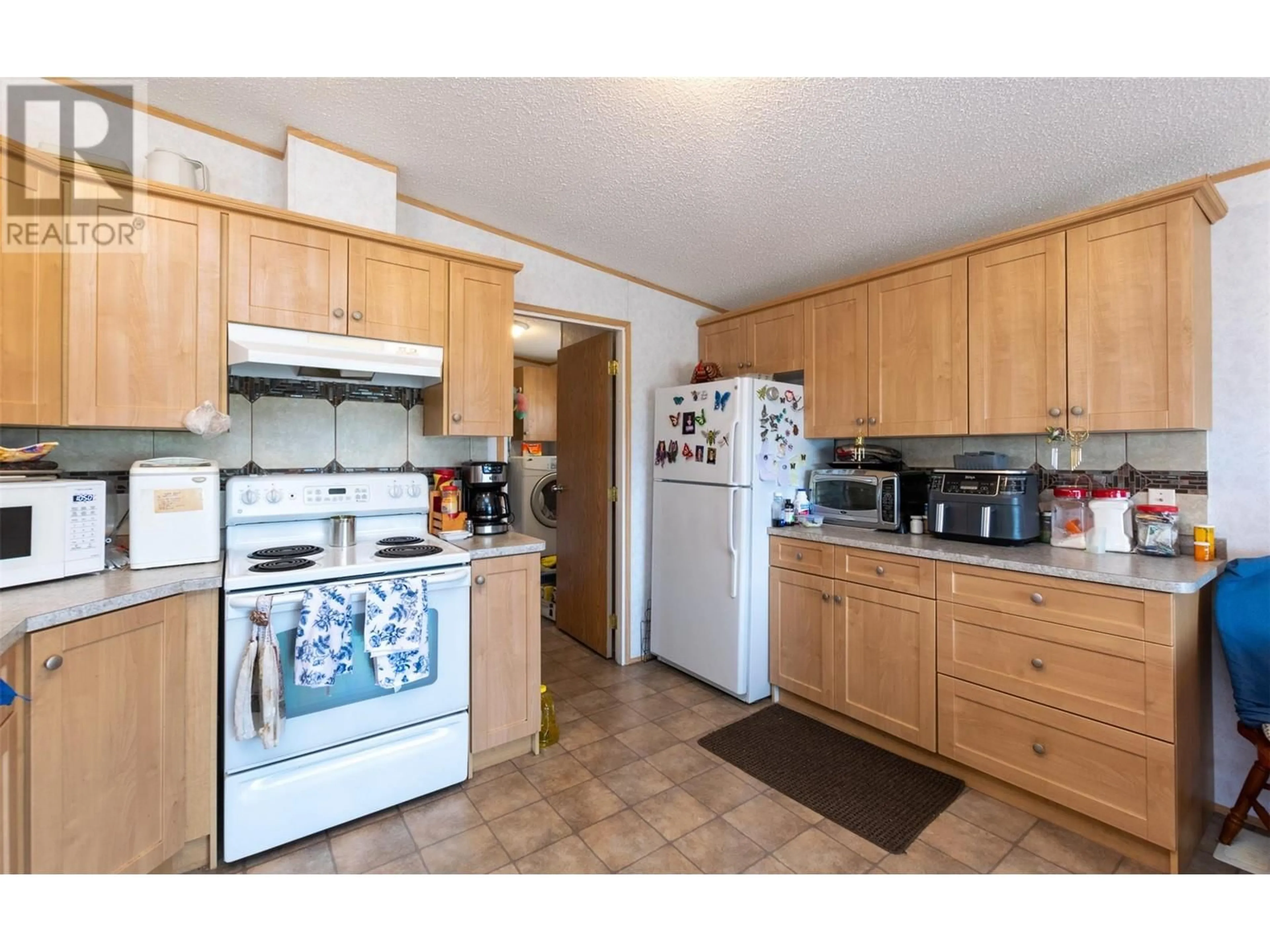 Standard kitchen, wood floors, cottage for 1885 Tappen Notch Hill Road Unit# 42, Tappen British Columbia V0E2X0