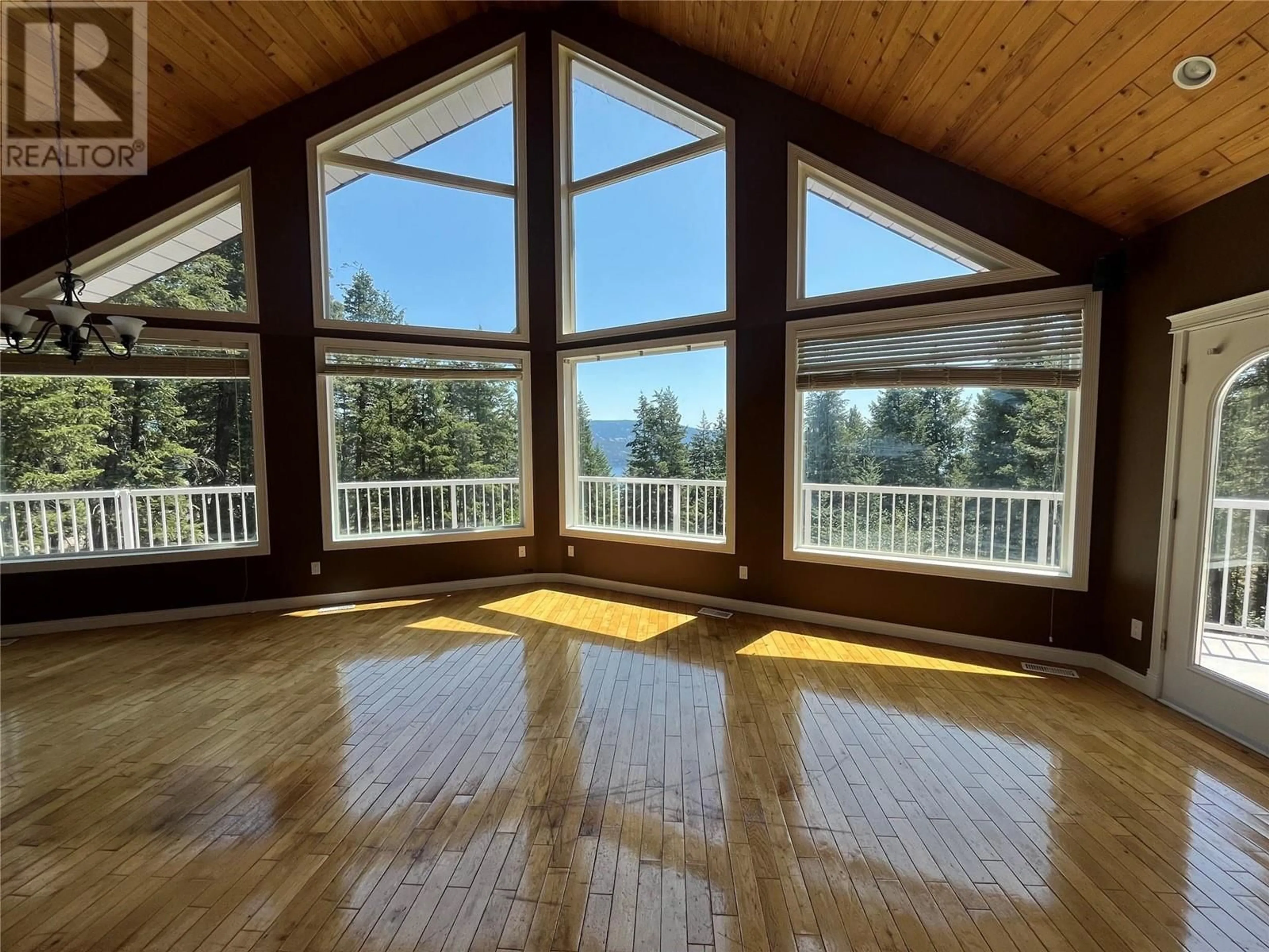 A pic of a room, wood floors for 9515 Keithley Road, Vernon British Columbia V1H2E5