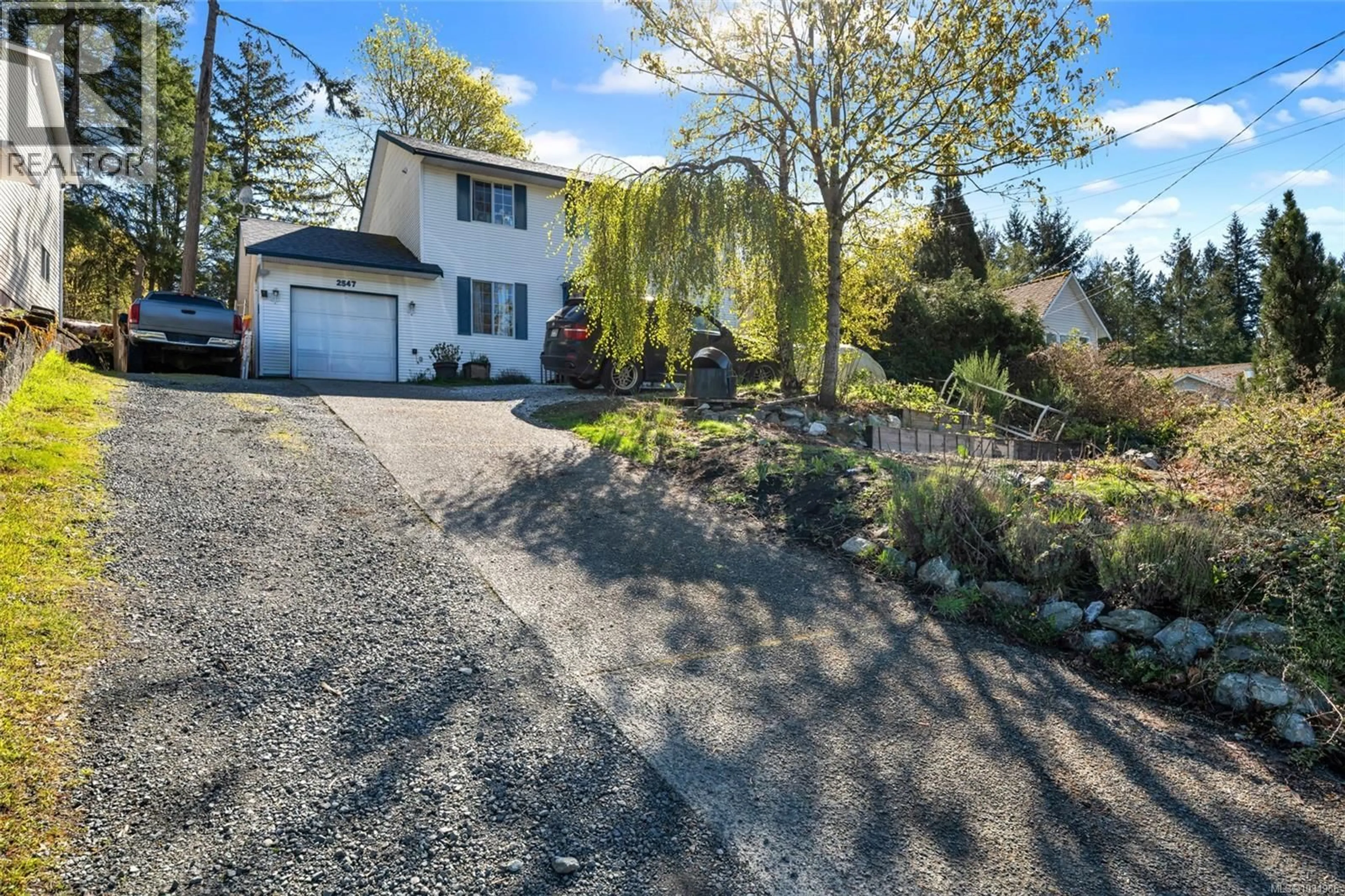 A pic from outside/outdoor area/front of a property/back of a property/a pic from drone, street for 2547 DAVIDSON ROAD, Shawnigan Lake British Columbia V0R2W2
