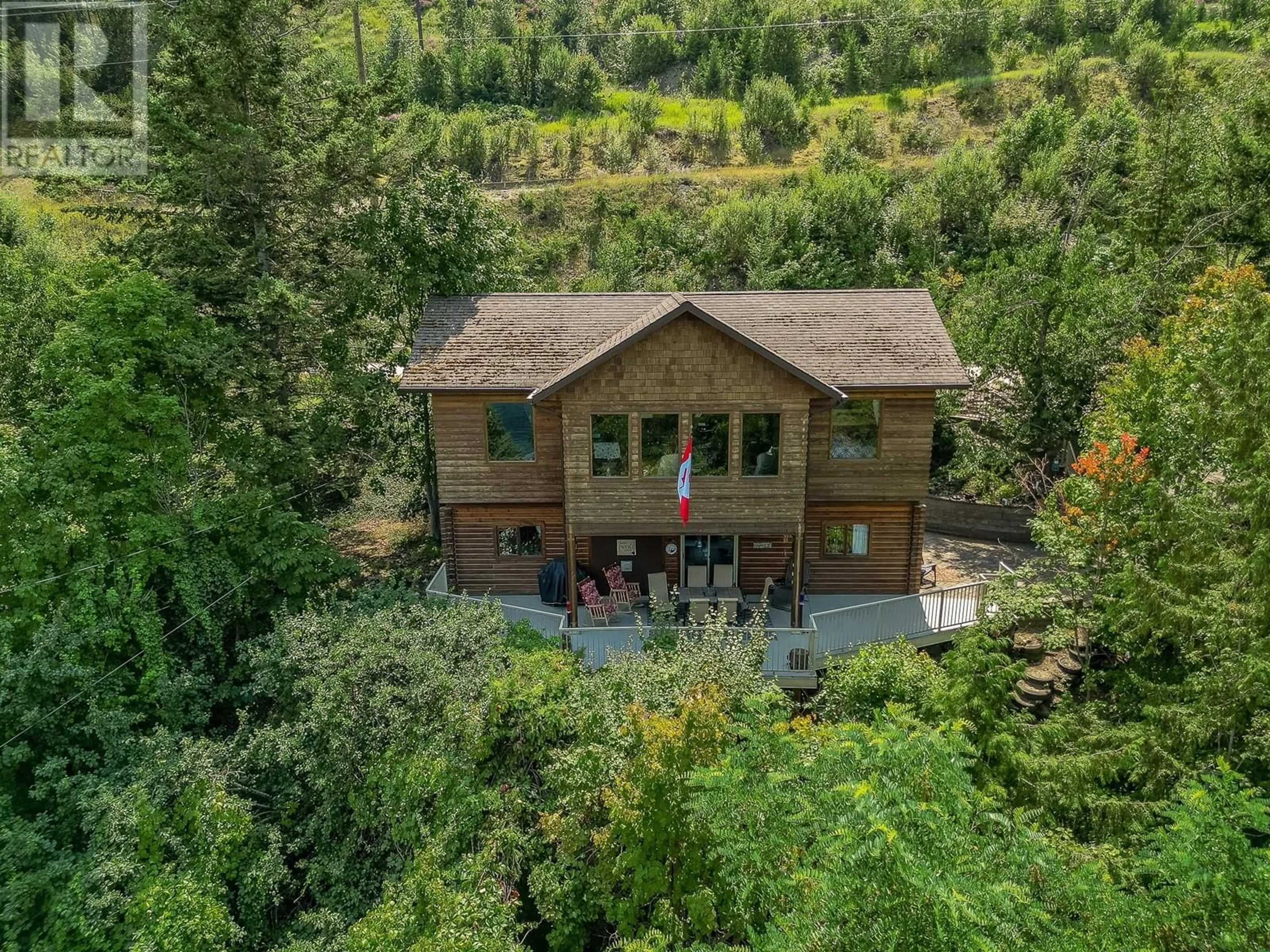 A pic from outside/outdoor area/front of a property/back of a property/a pic from drone, forest/trees view for 1 OLD SICAMOUS ROAD, Sicamous British Columbia V0E2V0