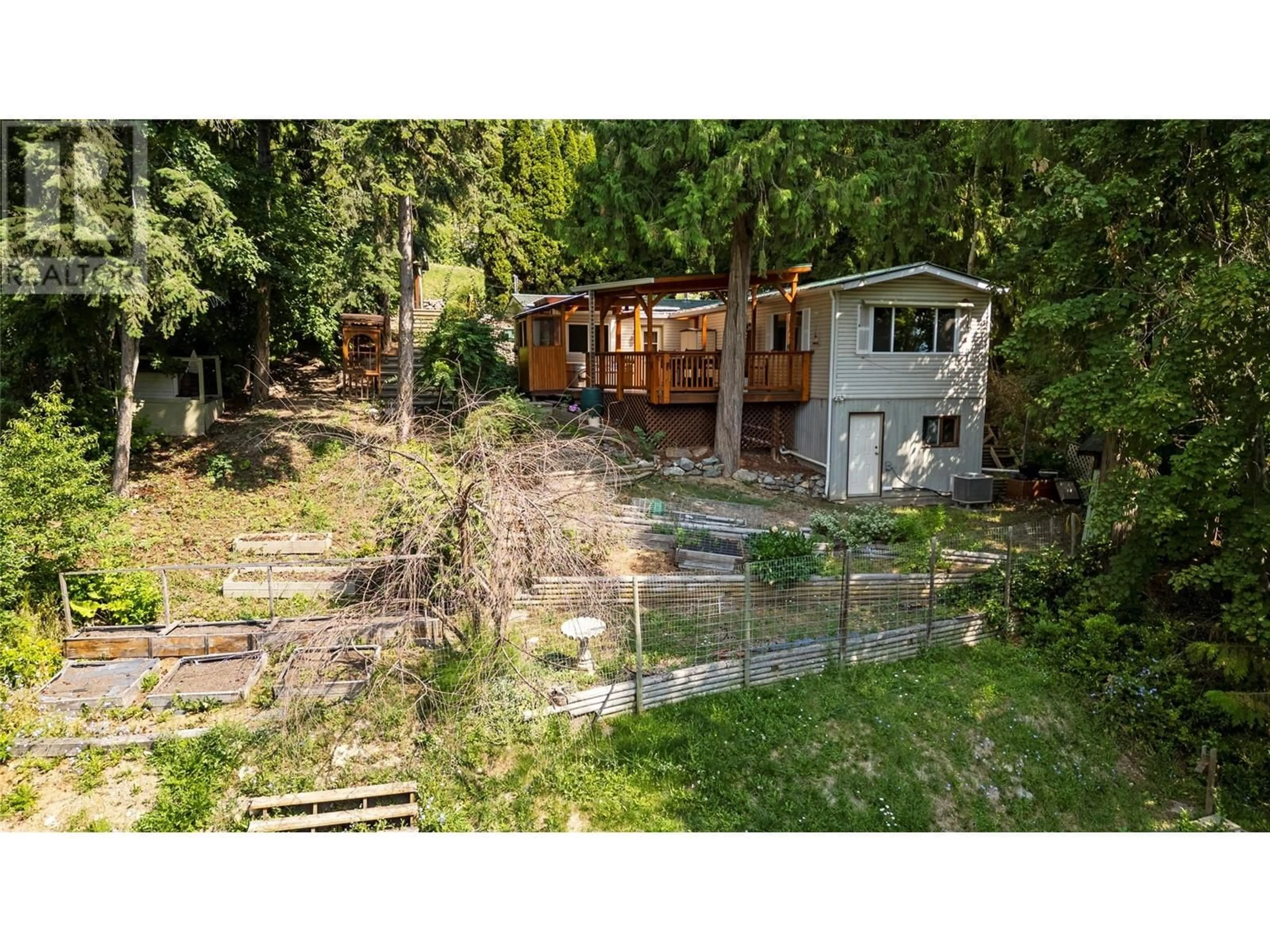 Frontside or backside of a home, the fenced backyard for 1243 Lee Creek Drive, Lee Creek British Columbia V0E1M4