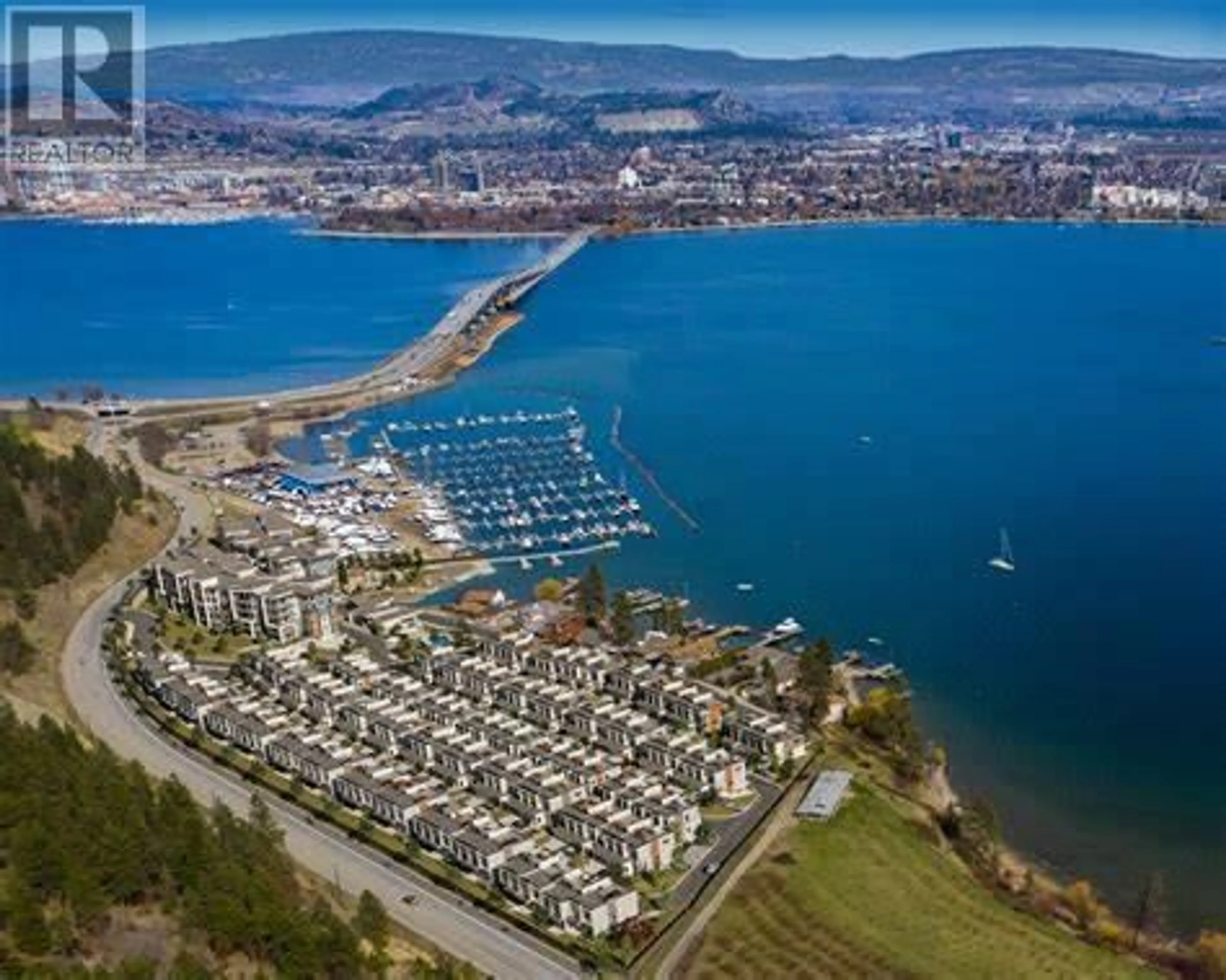 A pic from outside/outdoor area/front of a property/back of a property/a pic from drone, water/lake/river/ocean view for 207 - 2100 CAMPBELL ROAD, West Kelowna British Columbia V1Z0A7