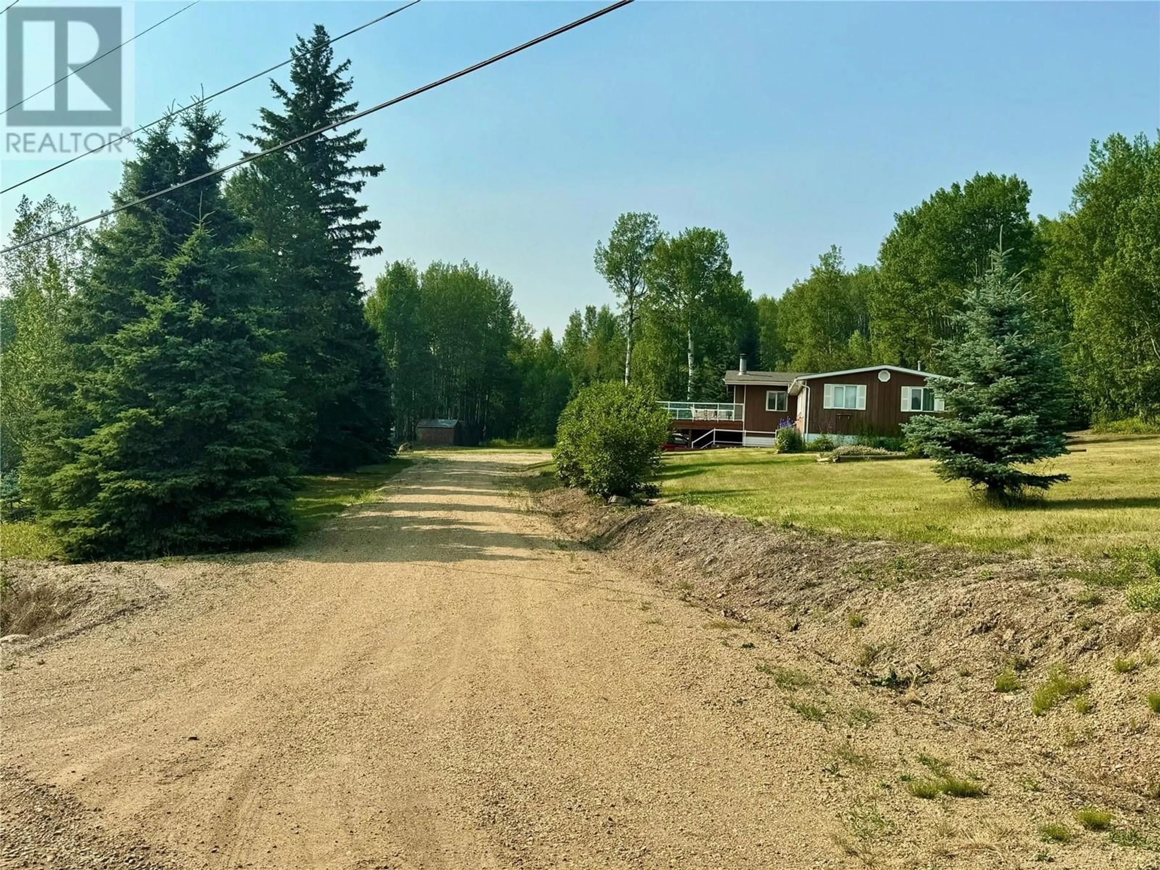 A pic from outside/outdoor area/front of a property/back of a property/a pic from drone, unknown for 4956 212 Road, Dawson Creek British Columbia V1G4E7