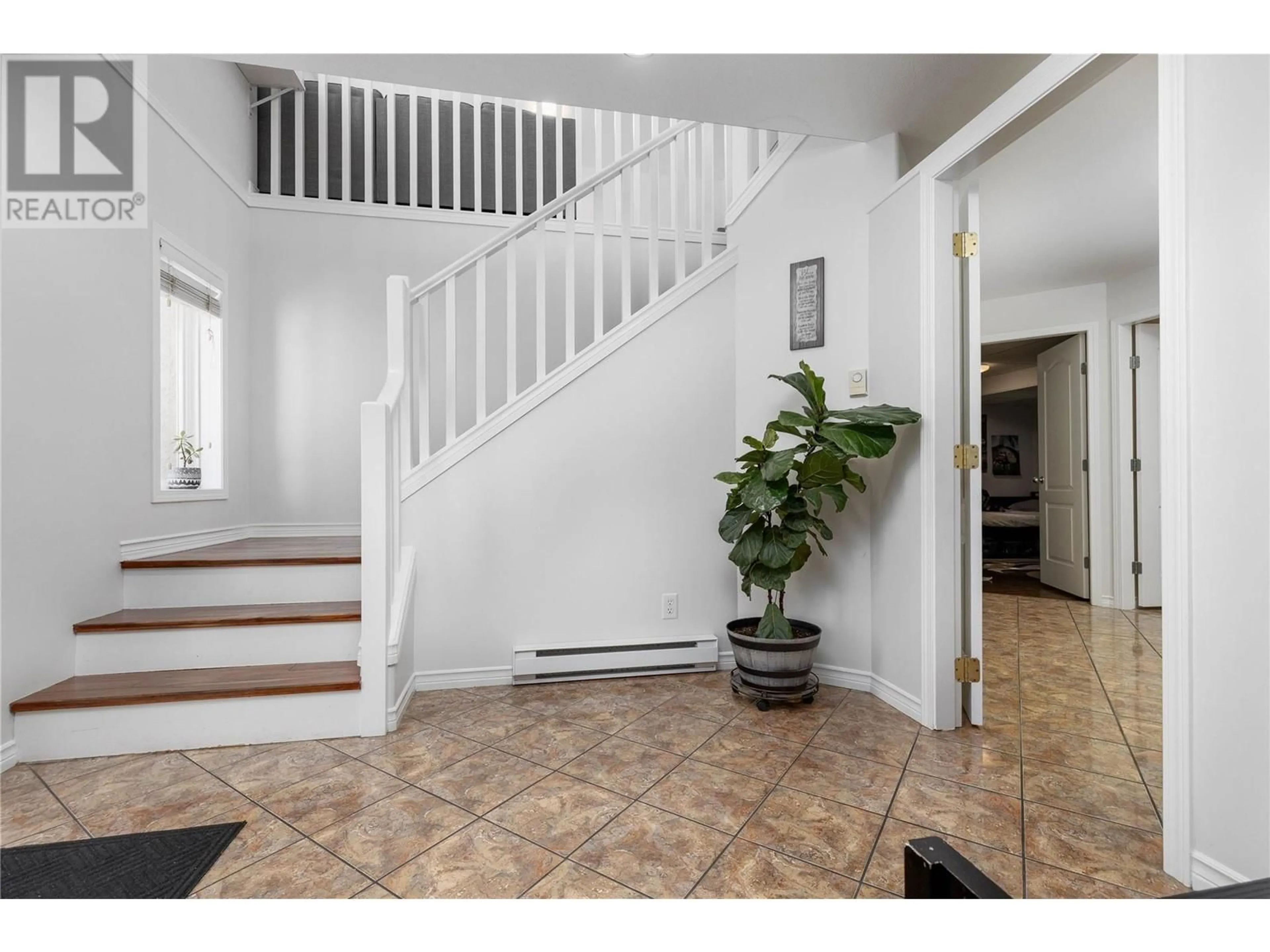 Indoor entryway, wood floors for 3090 Quail Run Drive, Kelowna British Columbia V1V1Z9