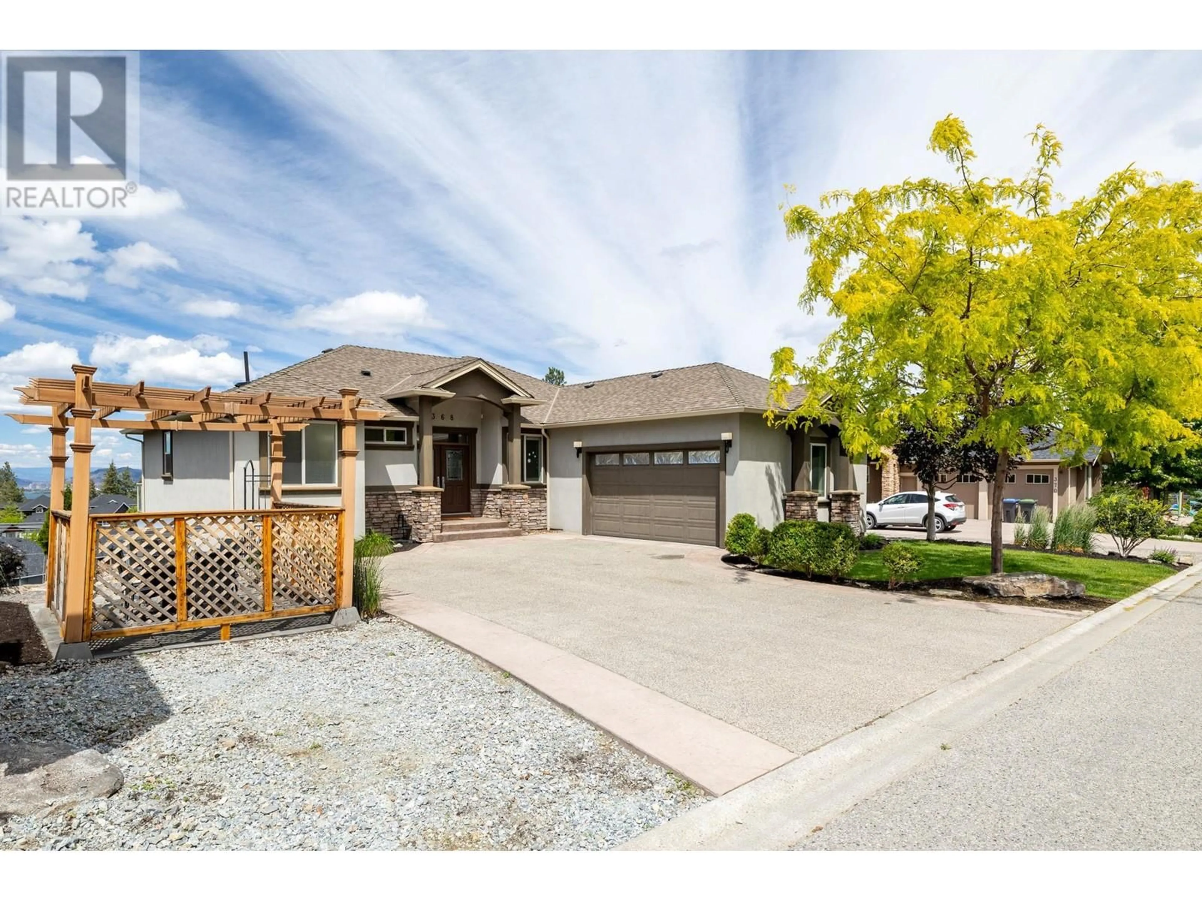 Frontside or backside of a home, the street view for 368 Trumpeter Court, Kelowna British Columbia V1W5J4