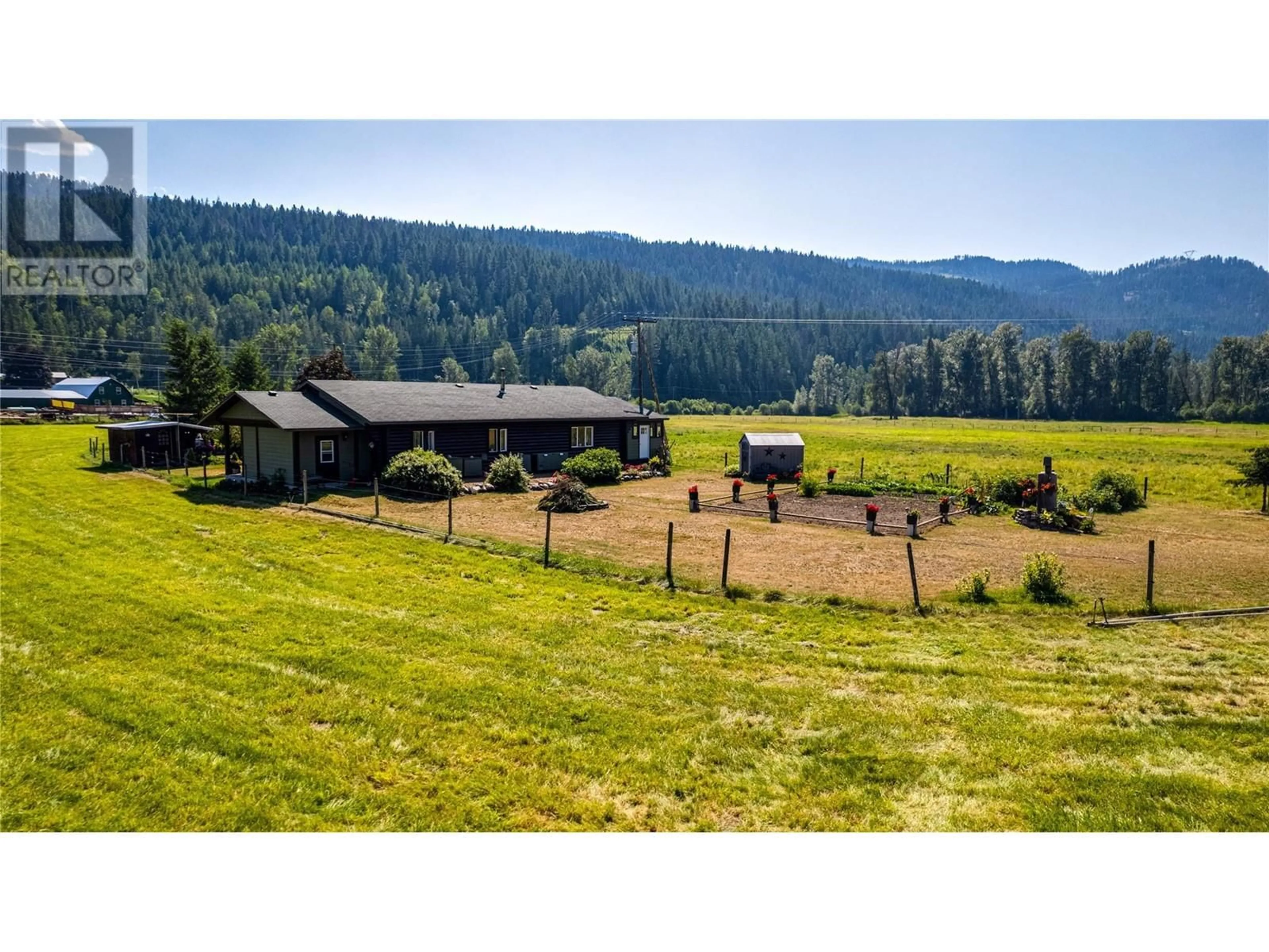 A pic from outside/outdoor area/front of a property/back of a property/a pic from drone, mountain view for 1519 6 HIGHWAY, Cherryville British Columbia V0E2G1