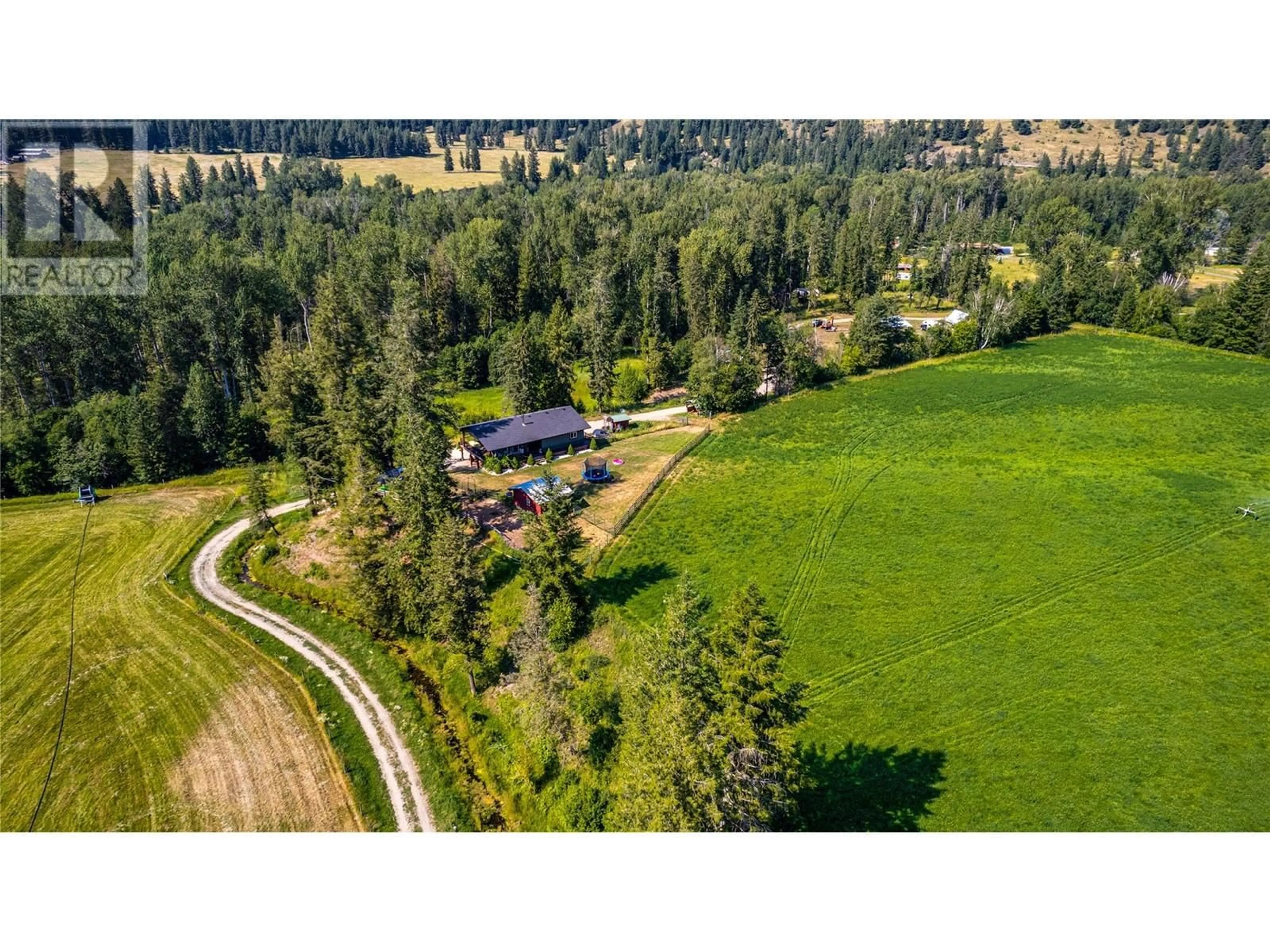 A pic from outside/outdoor area/front of a property/back of a property/a pic from drone, mountain view for 1519 6 HIGHWAY, Cherryville British Columbia V0E2G1