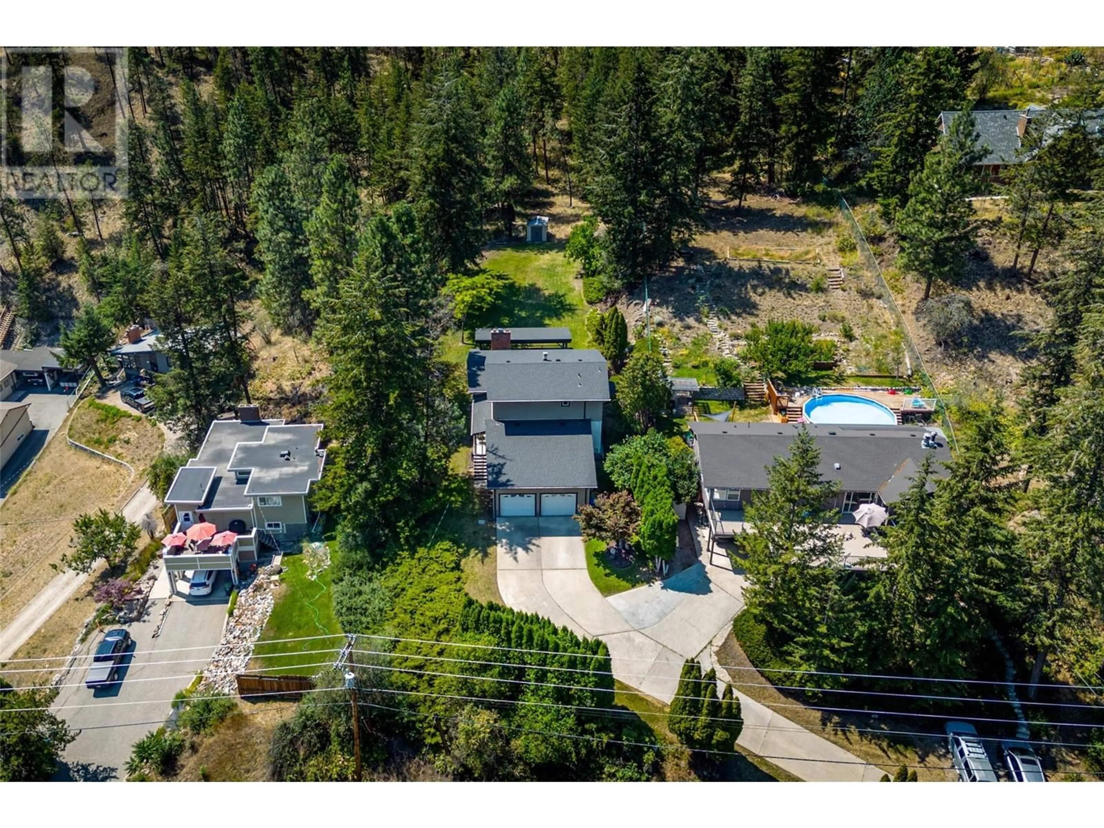 Frontside or backside of a home, the street view for 410 Clifton Road, Kelowna British Columbia V1V1A5