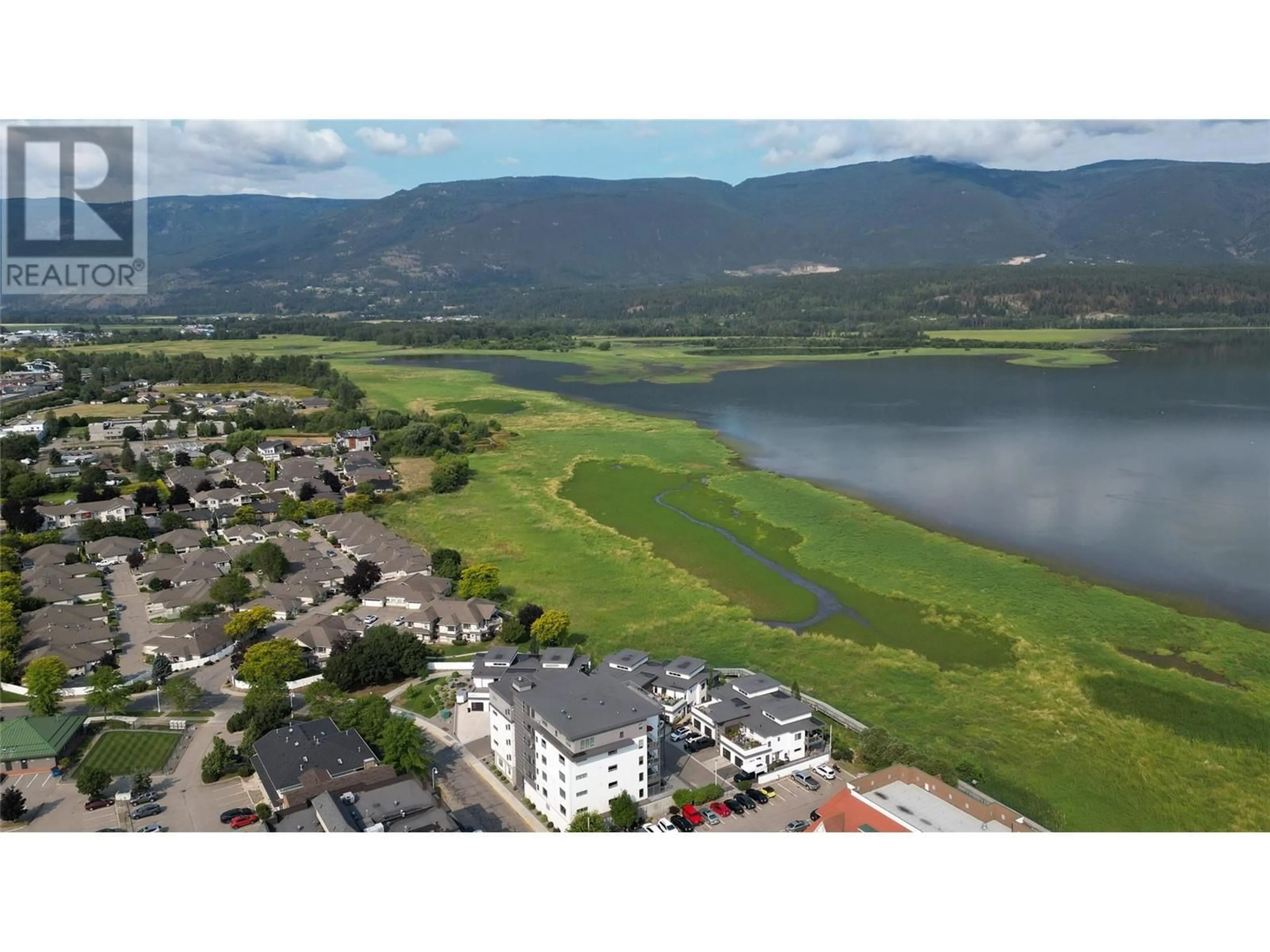 A pic from outside/outdoor area/front of a property/back of a property/a pic from drone, water/lake/river/ocean view for 131 Harbourfront Drive NE Unit# 503, Salmon Arm British Columbia V1E2T3