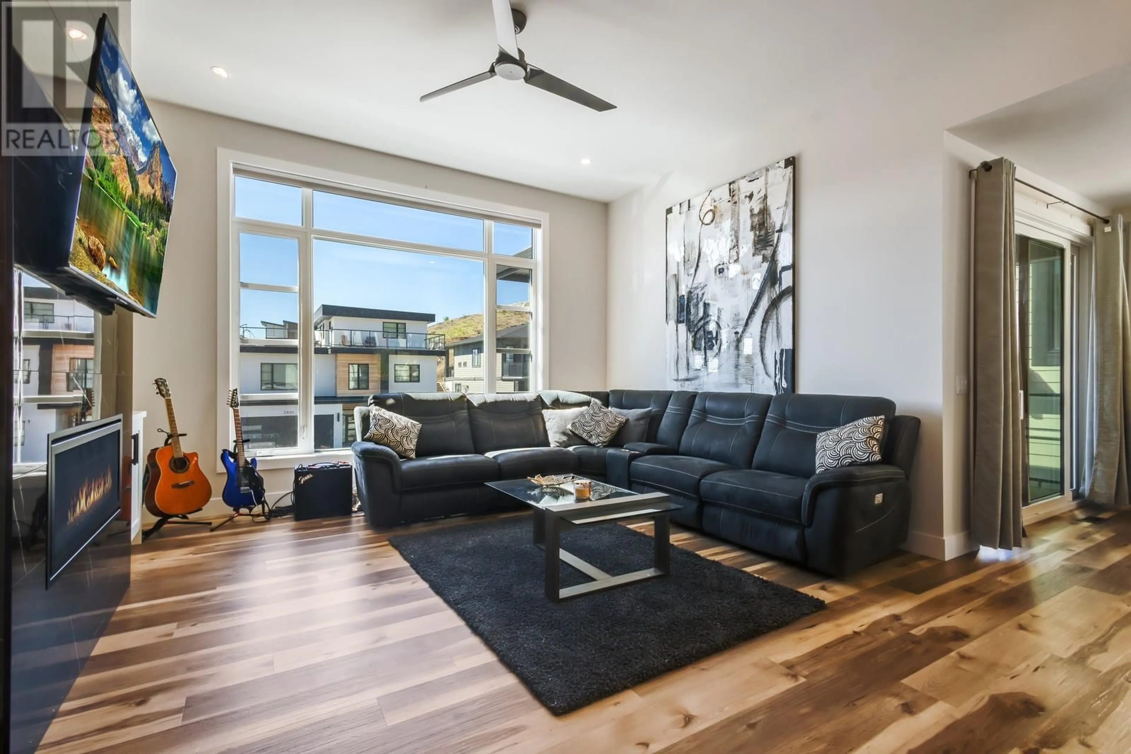 Living room with furniture, wood/laminate floor for 2834 CANYON CREST DRIVE, West Kelowna British Columbia V4T0E3