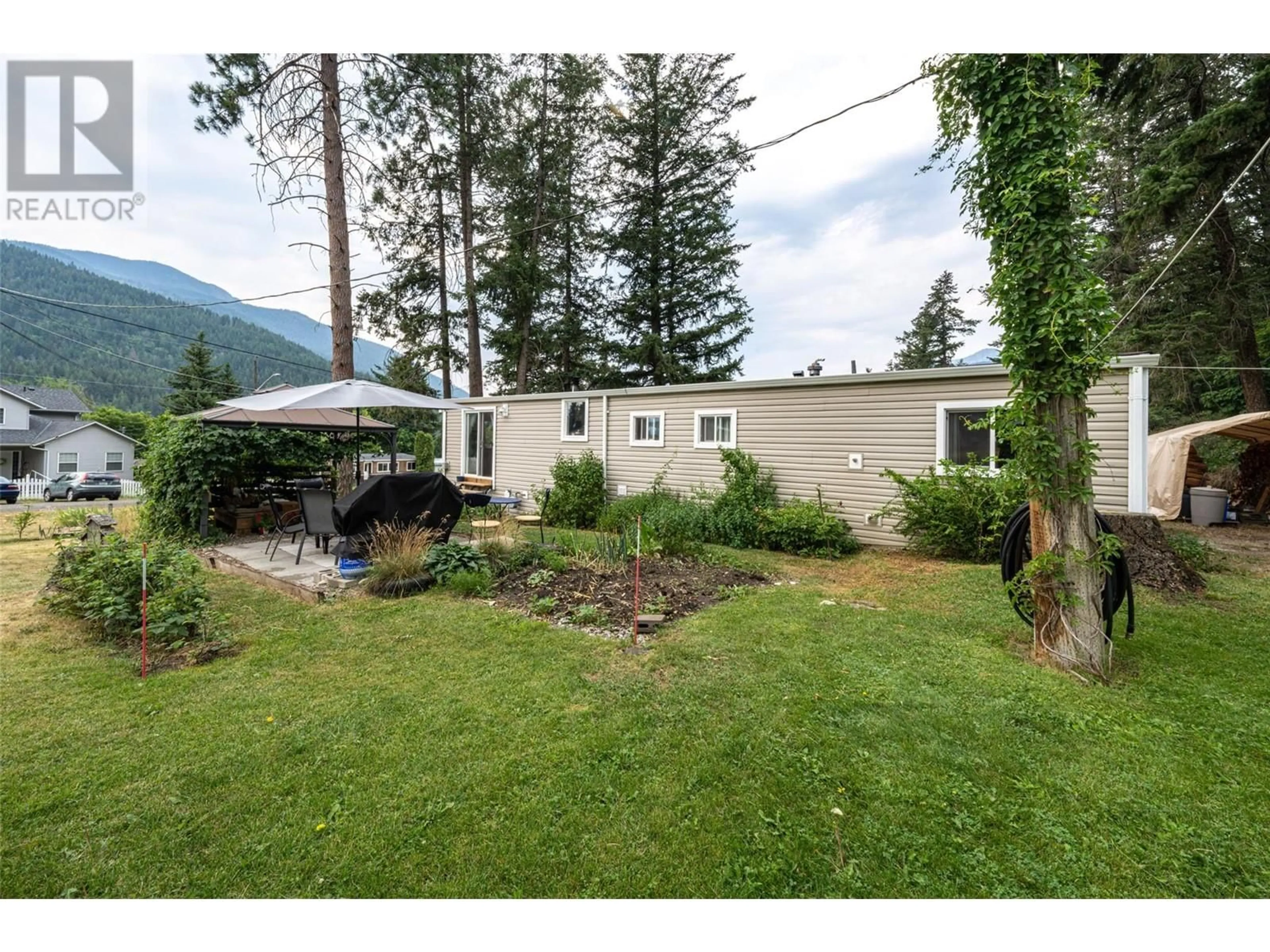 A pic from outside/outdoor area/front of a property/back of a property/a pic from drone, mountain view for 5664 Ponderosa Road, Falkland British Columbia V0E1W0