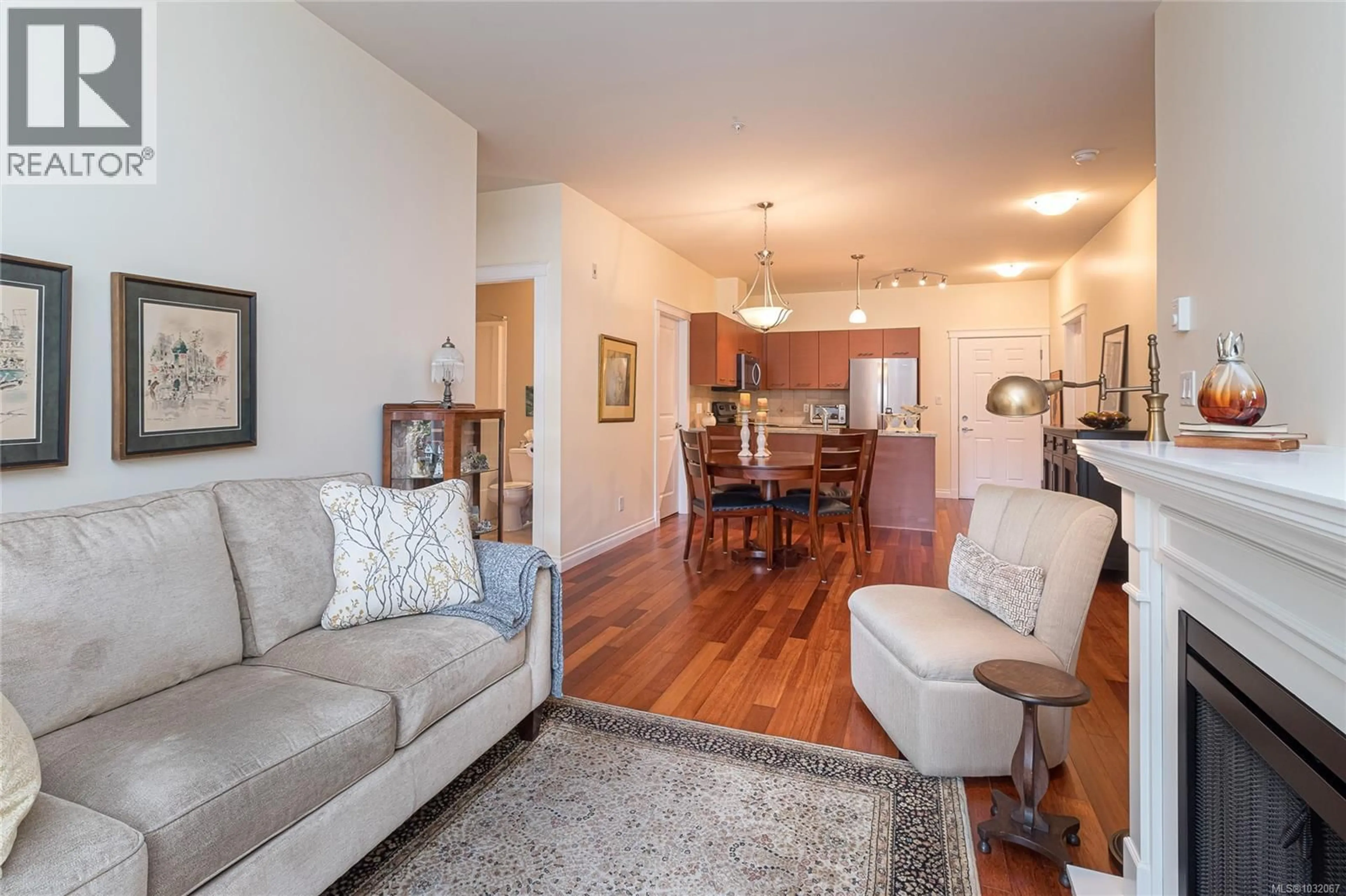 Living room with furniture, wood/laminate floor for 103 - 2380 BRETHOUR AVENUE, Sidney British Columbia V8L2A5