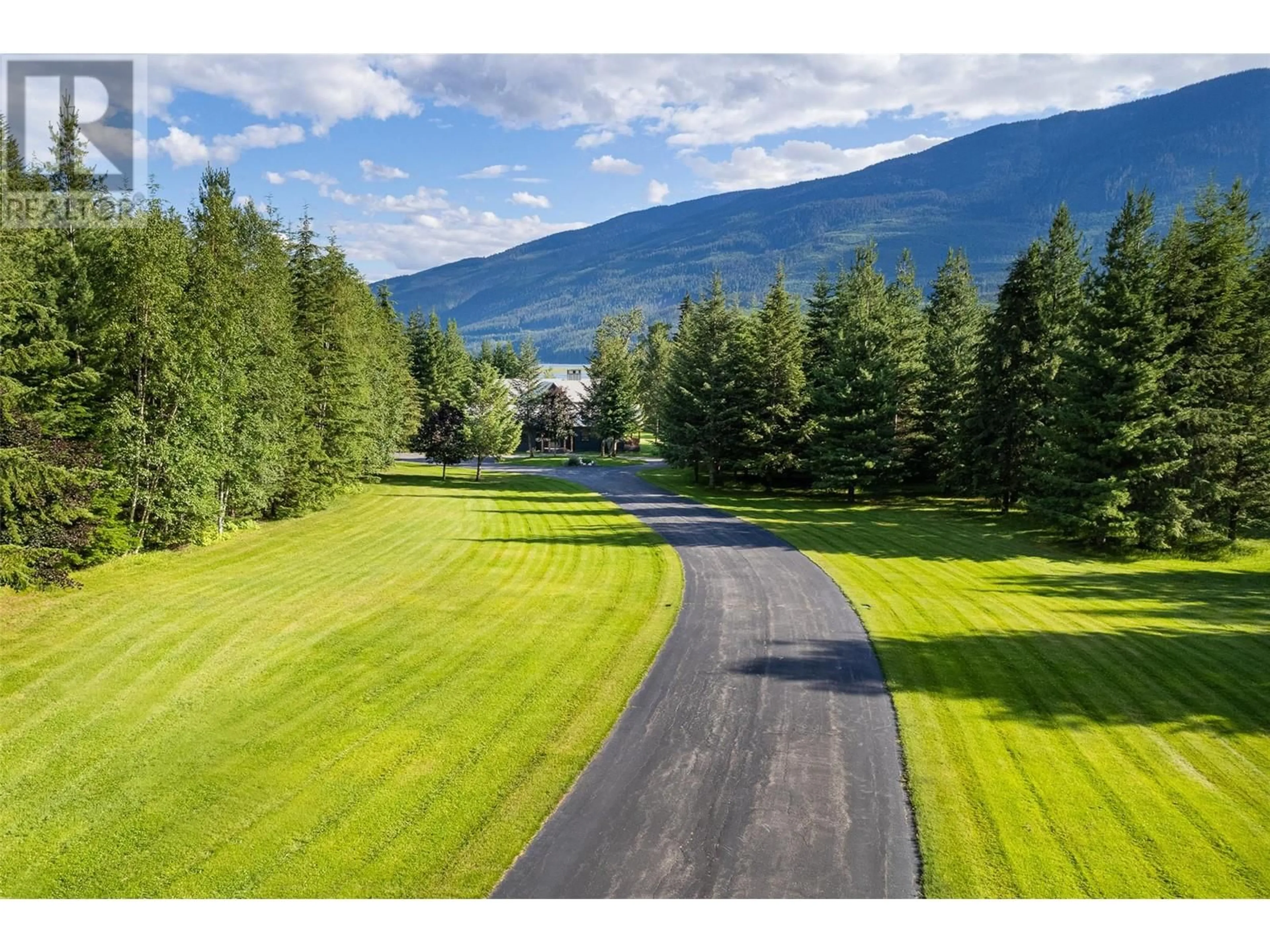 A pic from outside/outdoor area/front of a property/back of a property/a pic from drone, mountain view for 4785 Airport Way, Revelstoke British Columbia V0E2S3