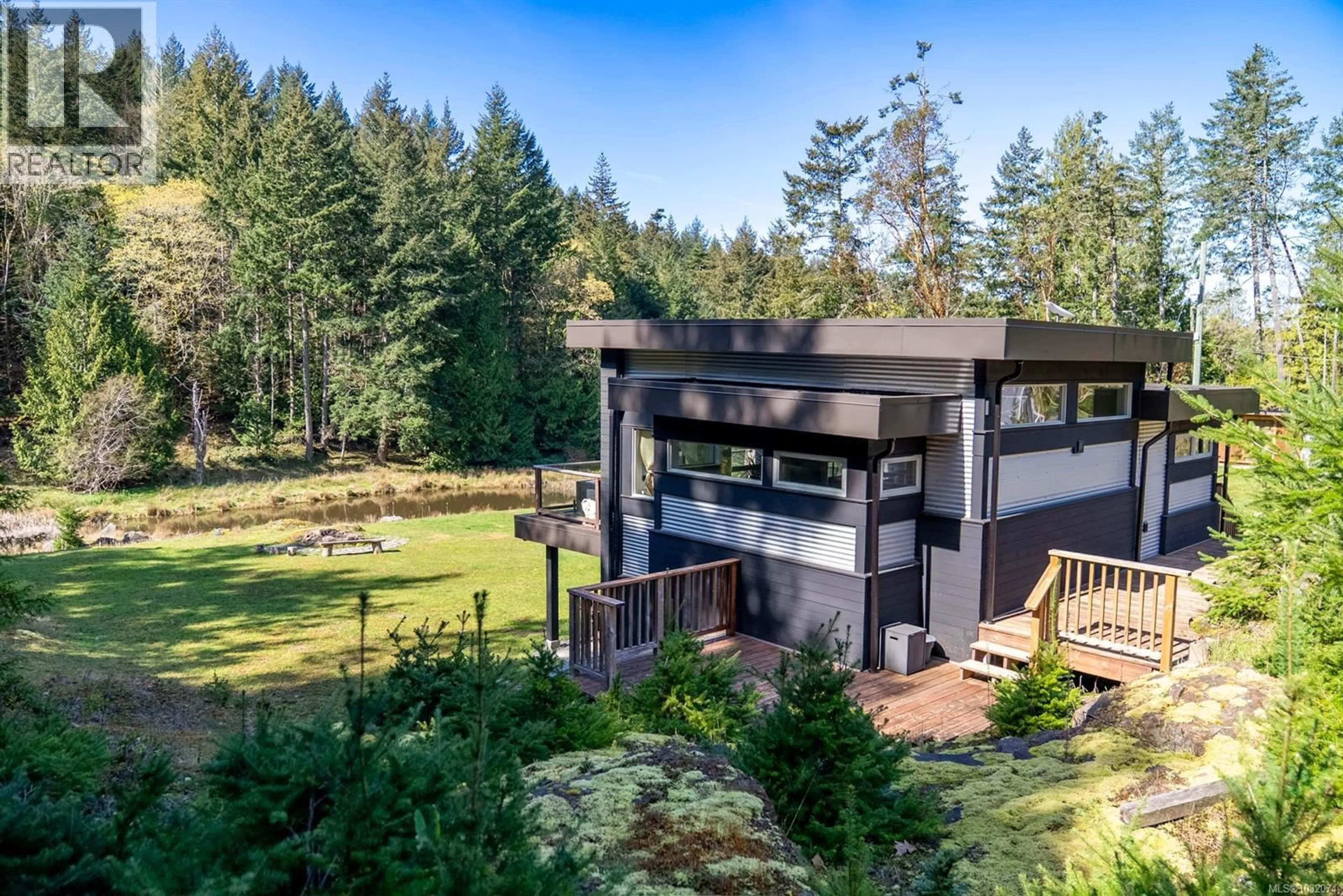 A pic from outside/outdoor area/front of a property/back of a property/a pic from drone, forest/trees view for 5582 HOOSON ROAD, Pender Island British Columbia V0N2M1