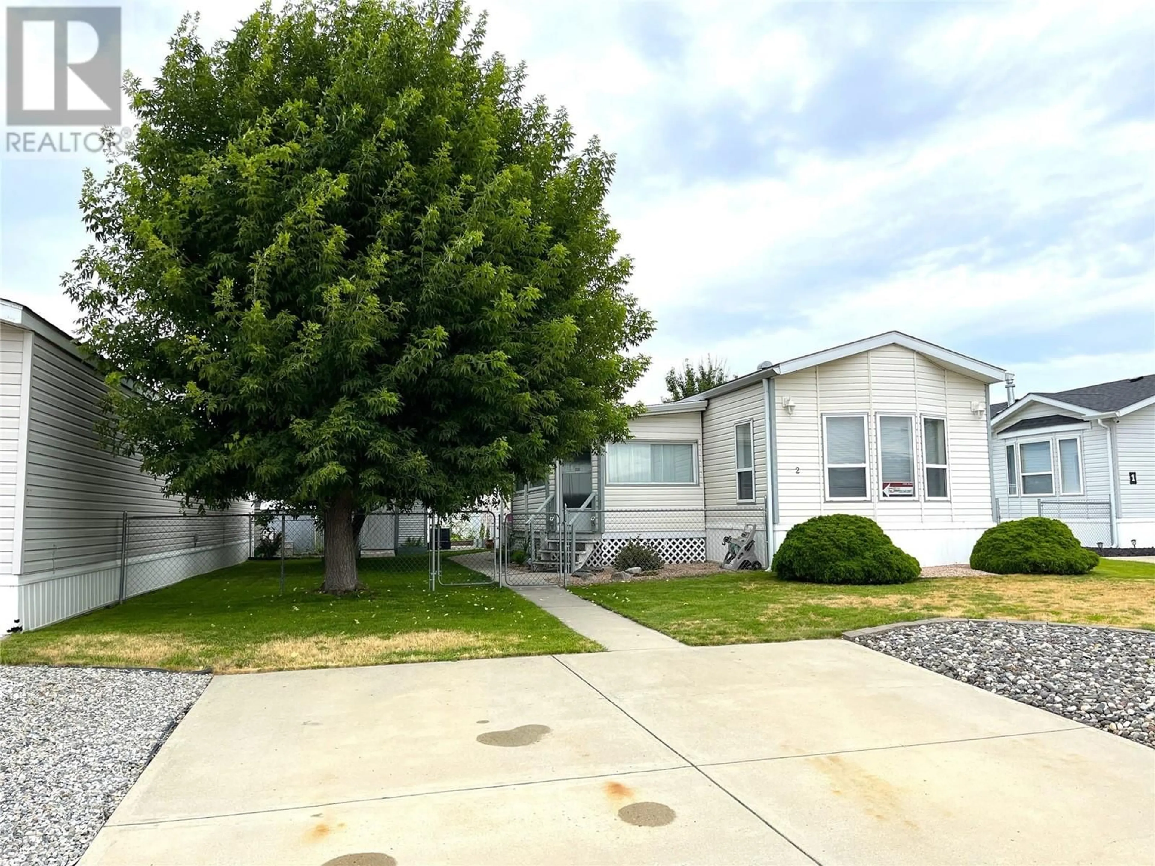 A pic from exterior of the house or condo, the street view for 12560 Westside Road Unit# 2, Vernon British Columbia V1H1S9