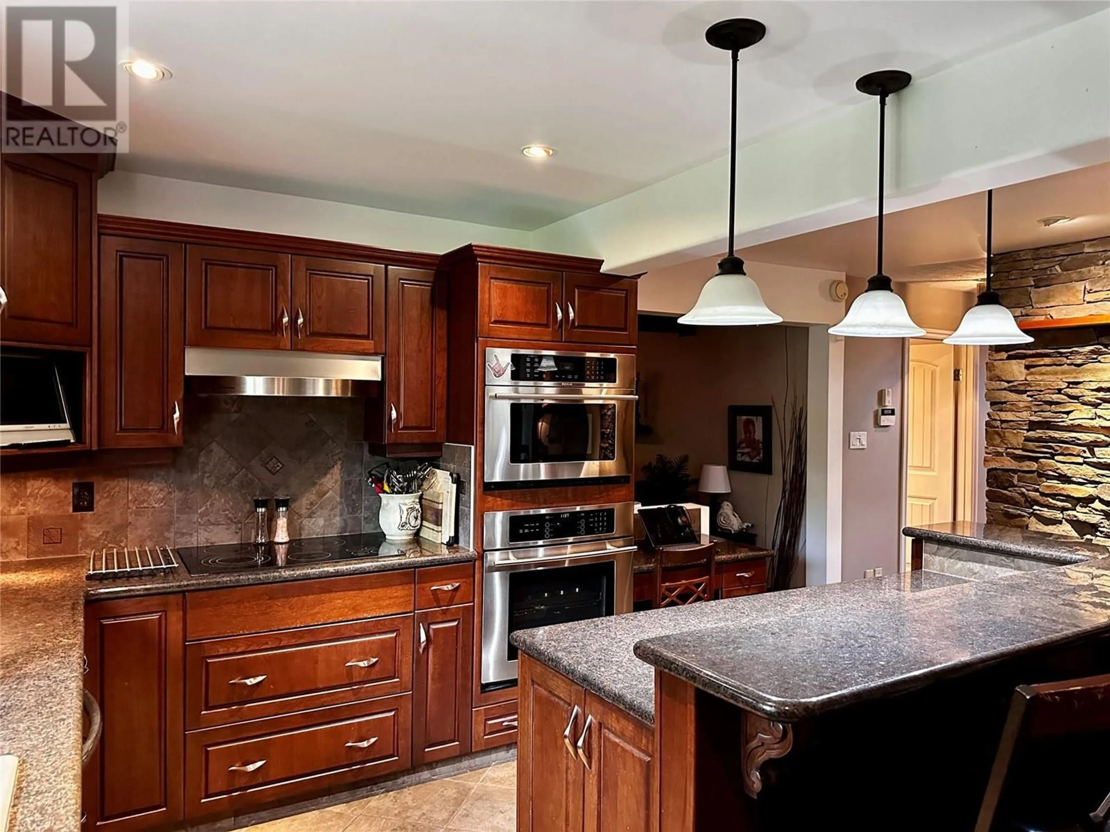 Contemporary kitchen, wood floors for 10701 Pinecrest Lane, Dawson Creek British Columbia V1G4M6