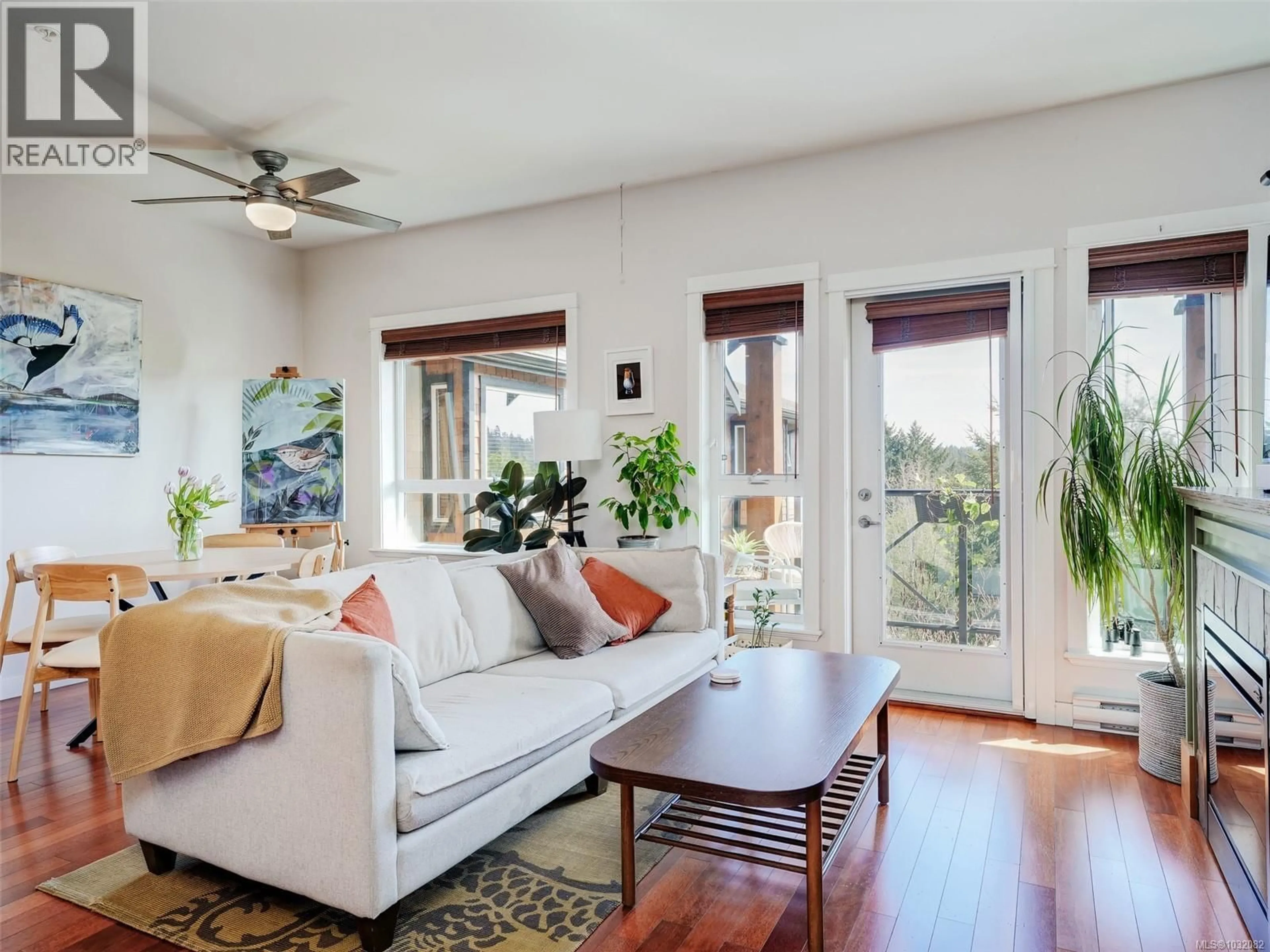 Living room with furniture, wood/laminate floor for 404 - 201 NURSERY HILL DRIVE, View Royal British Columbia V9B0H5