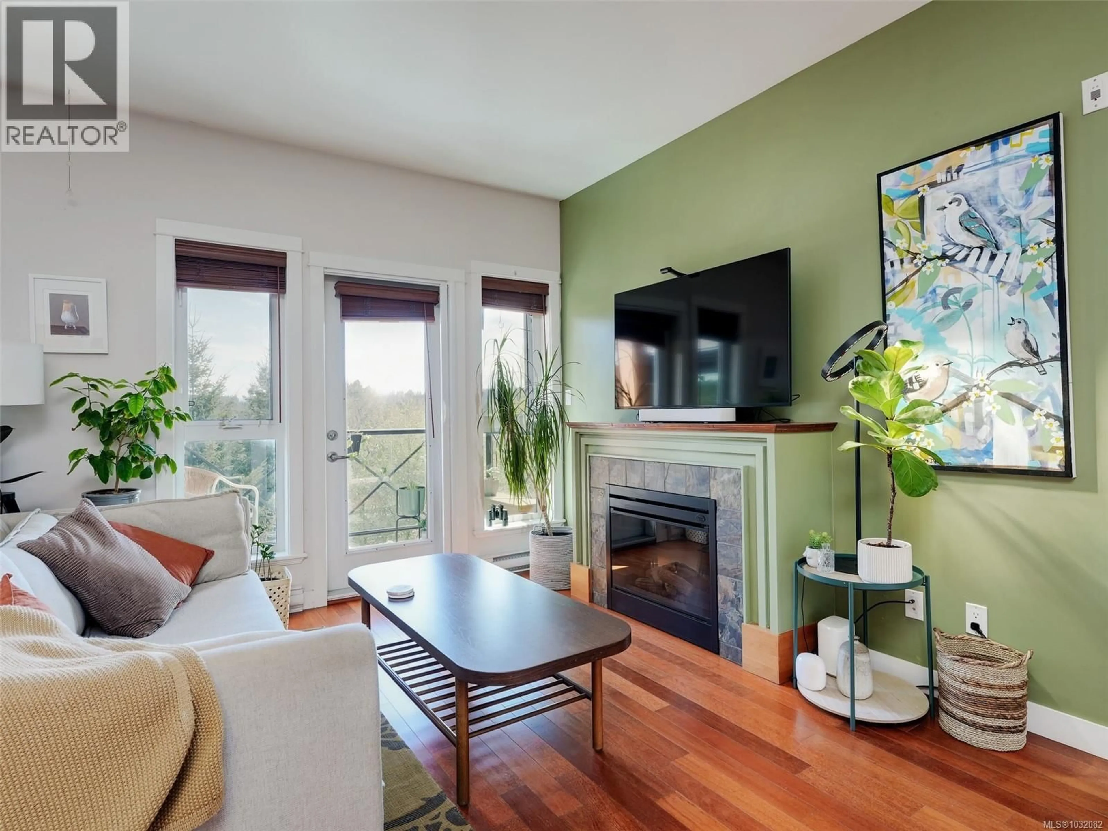 Living room with furniture, wood/laminate floor for 404 - 201 NURSERY HILL DRIVE, View Royal British Columbia V9B0H5